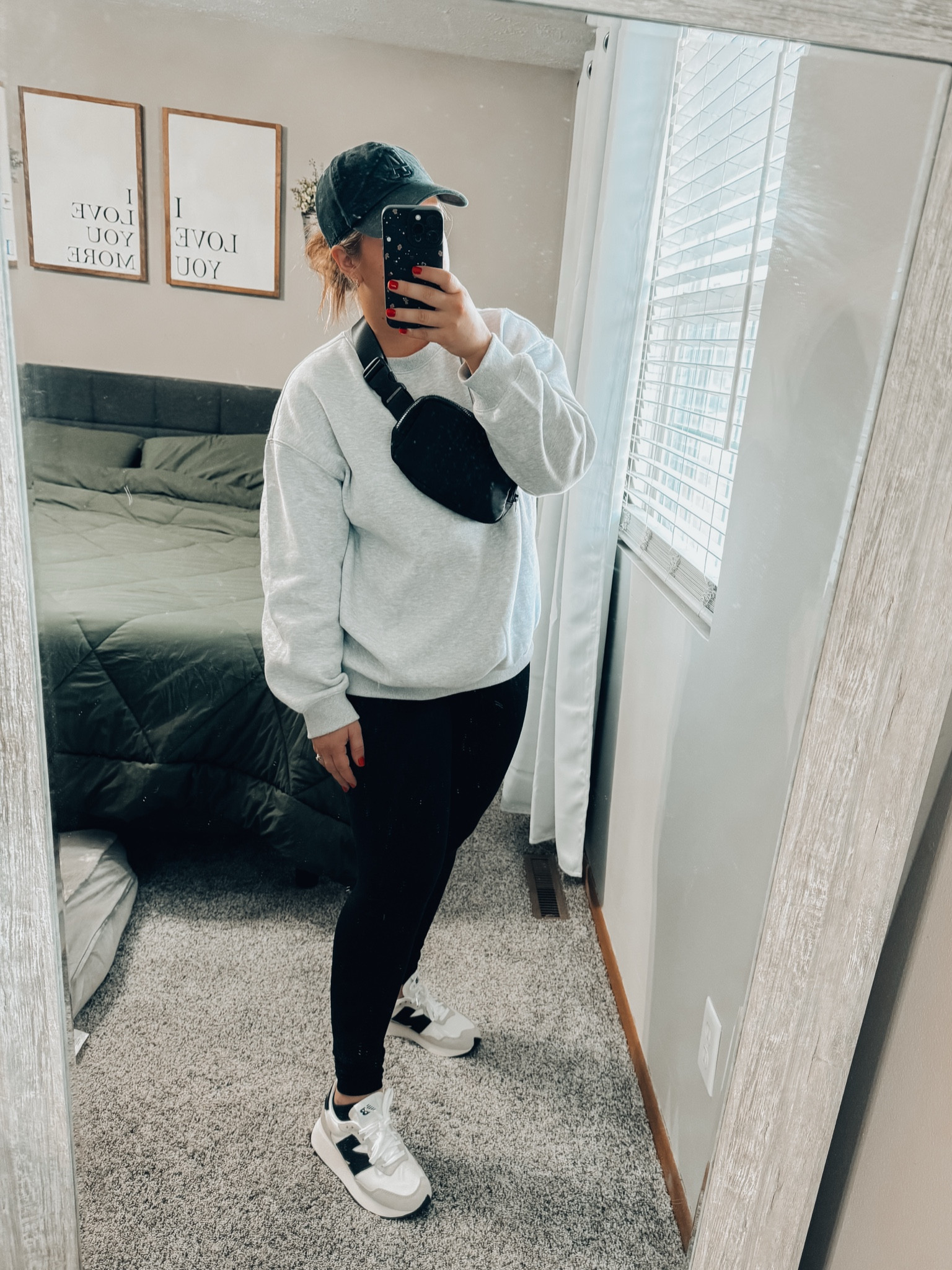 Weekend errand running sporty mom look - high rise buttery soft black leggings - New Balance Woman’s sport sneakers - oversized ash grey crewneck sweatshirt - super soft and cozy - cross body black zipper belt bag - baseball caps for women 

#LTKShoeCrush #LTKFindsUnder100 #LTKMidsize