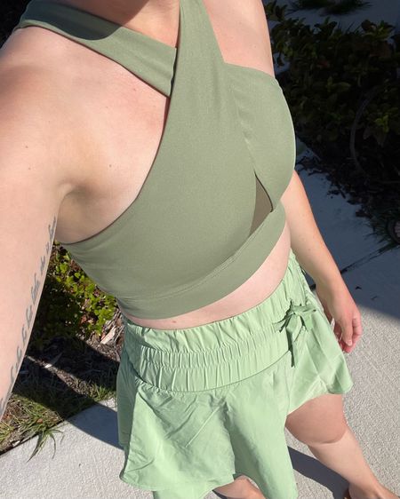 Athleisure outfit in sage green. 
Crisscross Nike sports bra.
High waisted skirt under $25  

#LTKxTarget