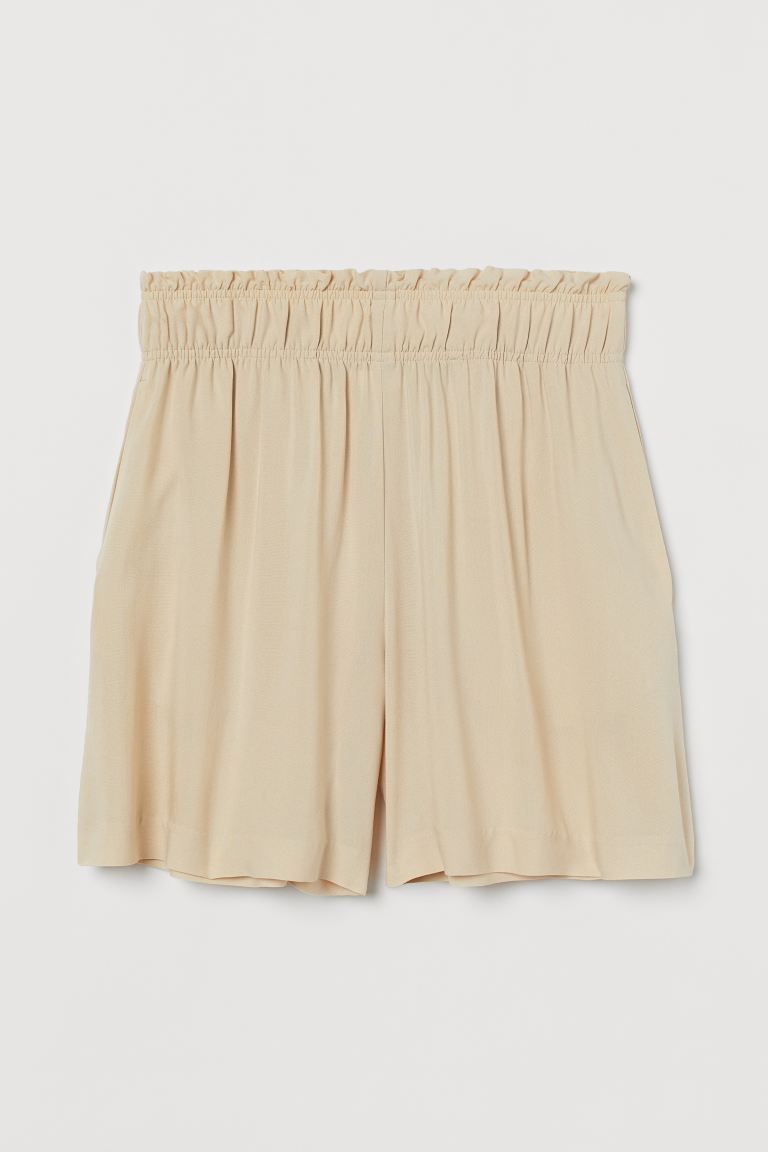 Shorts in woven viscose fabric. High waist, ruffle-trimmed waistband with covered elastic, and di... | H&M (US + CA)