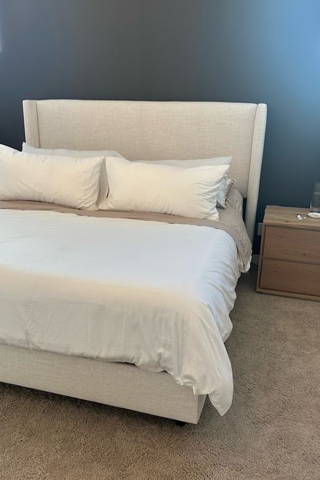 Bedroom links 

Neutral bed, natural wood nightstand, gold chandelier 