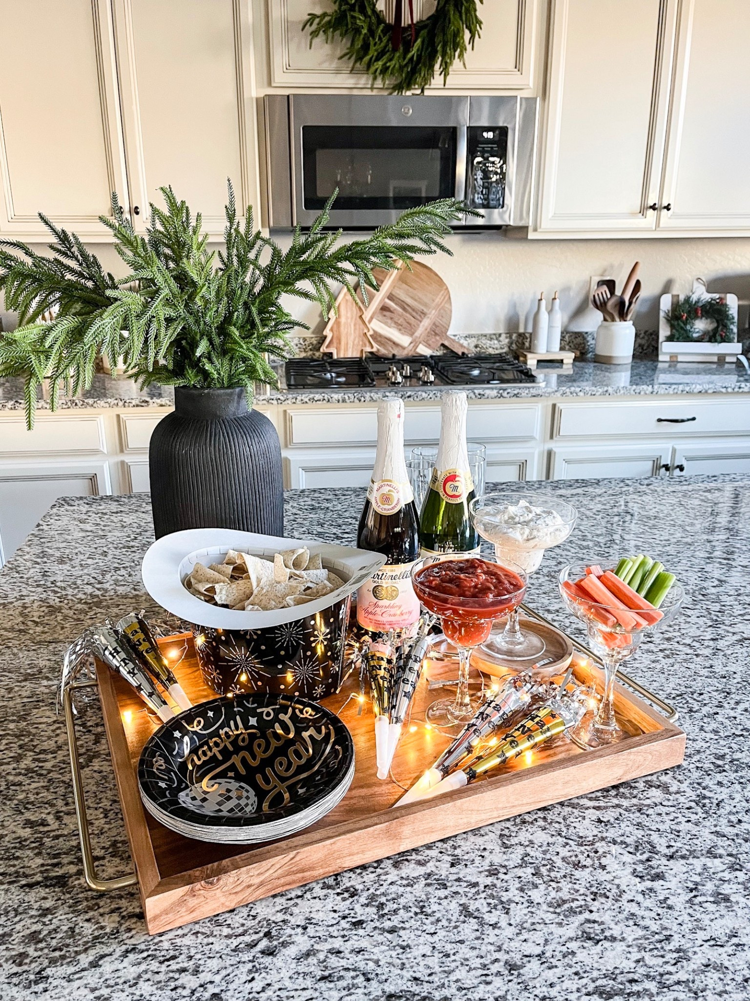 Whether you are ringing in the New Year with friends or a small family gathering at home, l'll show you a fun way to make the night festive!✨🎉
Follow @lifeinmyarizonahome on Instagram for more ideas and inspiration. 

I put together a festive tray with some party essentials.
I used New Year's plates and the top hat makes for the perfect chip bowl. The margarita glasses were great for dips and veggies. Don't forget sparkling cider, or champagne, noise makers, and twinkling lights.🥂

Do you go out or stay nome for New year?  You will usually find us at home making yummy food and playing games.

Cheers friends and many blessings for a healthy and happv New Year!

#LTKHoliday #LTKHome #LTKSeasonal