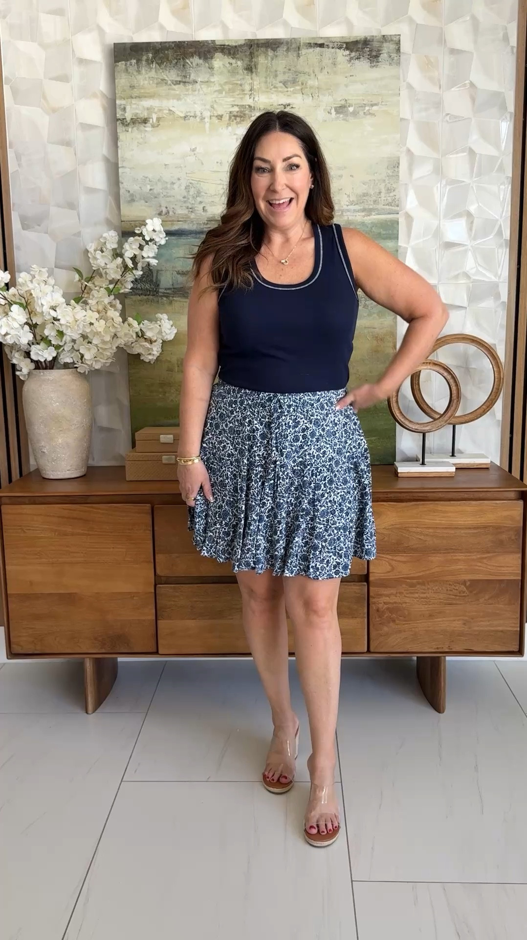 Casual but make it cute 💙 This navy tank and flowy printed skort combo is such an easy warm-weather outfit. Lightweight, breathable, and perfect for anything from errands to casual dinners. Added a fun textured bag for a little extra personality!

Sizing: tank tts, L // skort, L 

#LTKOver40 #LTKMidsize #LTKSeasonal