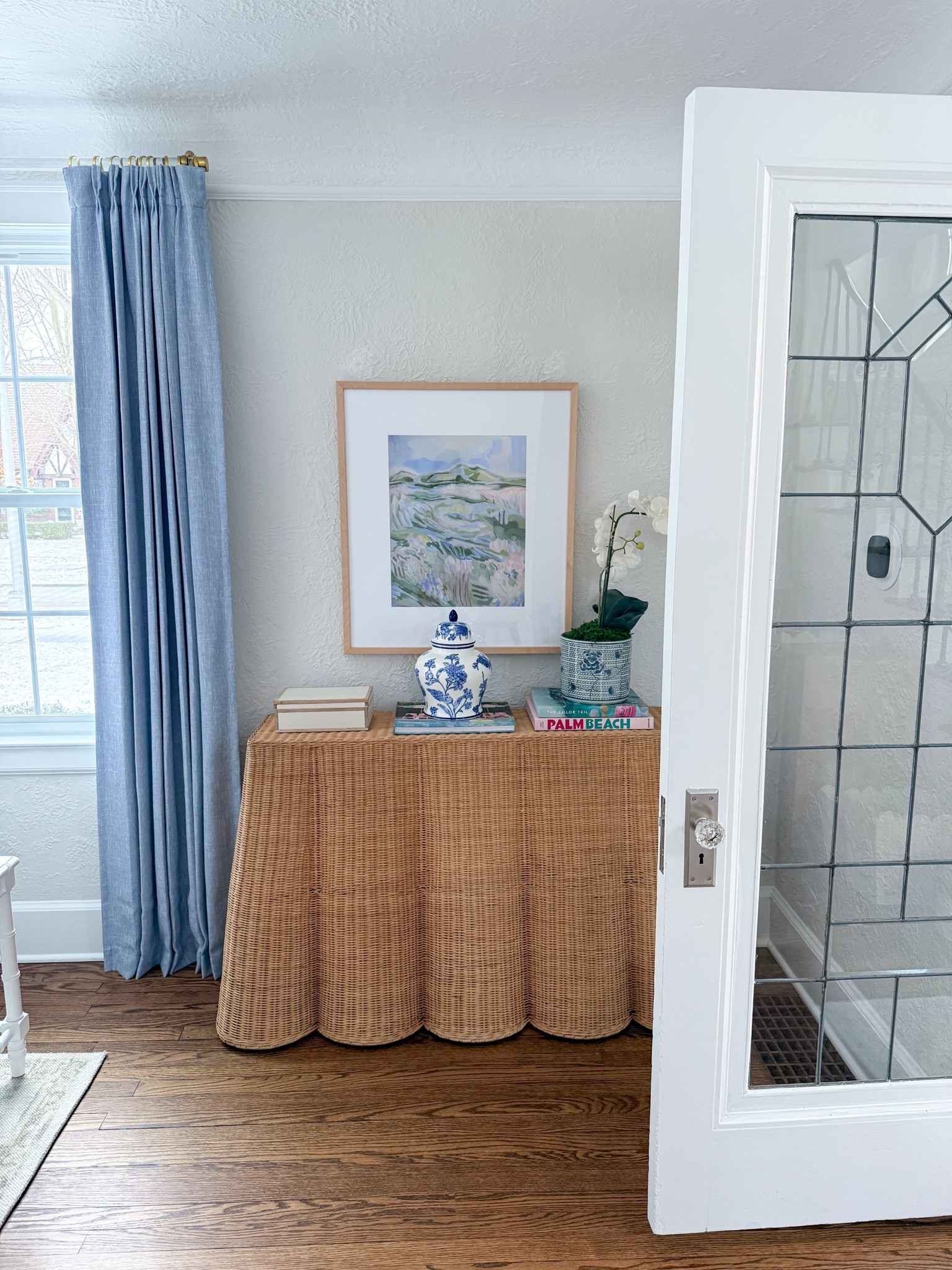 Rattan scallop condole table. My favorite piece of furniture I own right now!

#LTKHome