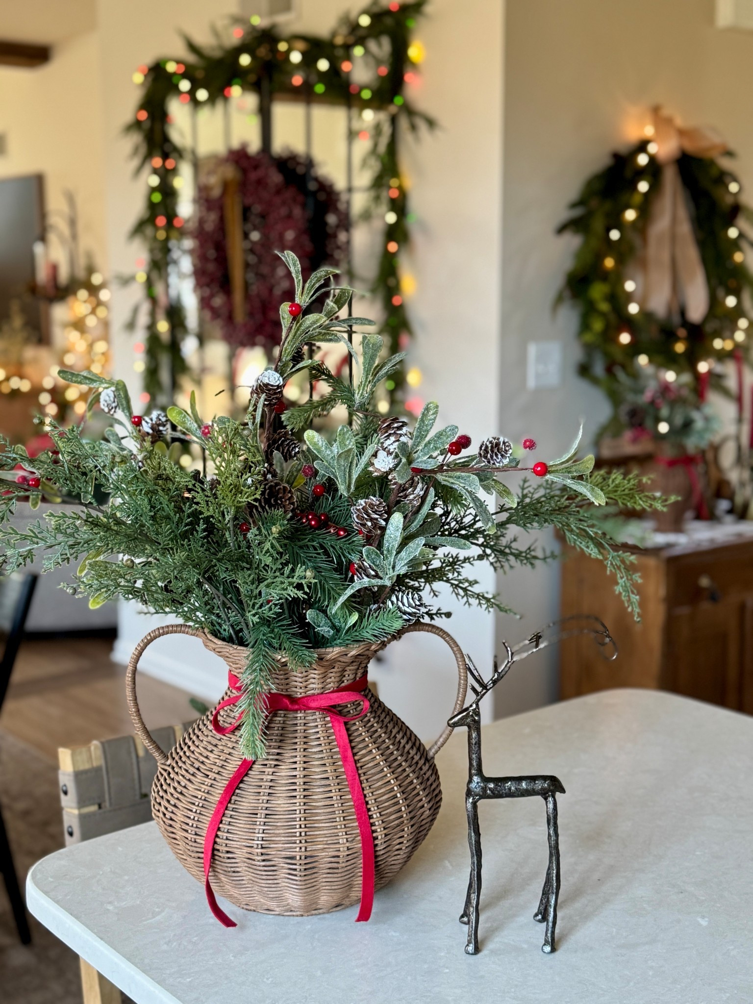 If you’ve been wanting this very popular but rather pricey woven vase, now is the time to buy. Both sizes are currently 25% off. This is the size small and it’s gorgeous! My sweet deer figurine, red velvet ribbon and some greens used to make my arrangement are currently on sale (some of the stems came from Hobby Lobby so unable to link.) Sharing my other woven vase (shown in the background) for an amazing price and one of my favorite wreaths. 

#LTKHome #LTKSaleAlert