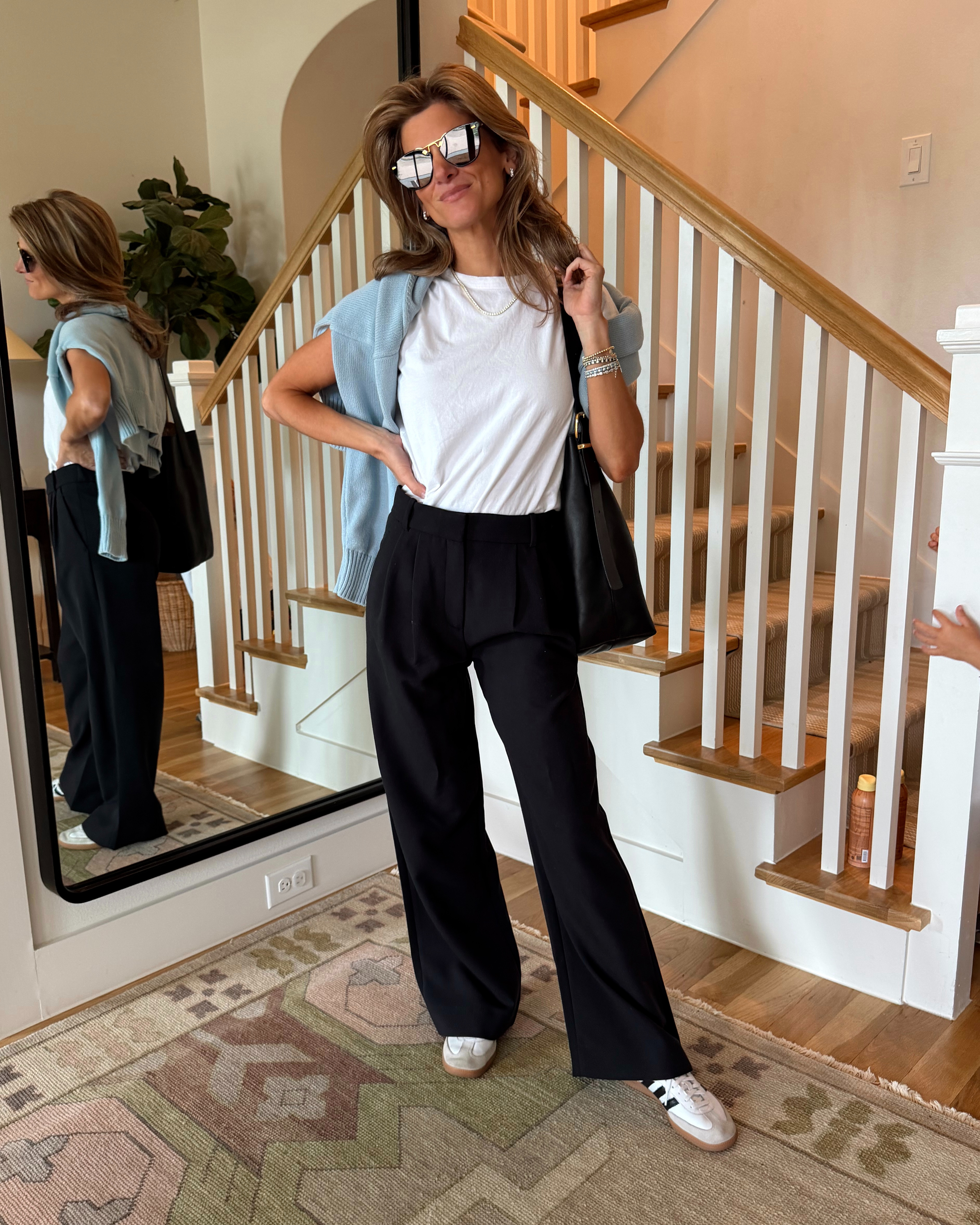 Abercrombie sloane trousers (petite length) and favorite leset tee (wearing XS). Madewell bucket bag and quince baby blue sweater for over the shoulders (XS) 

 