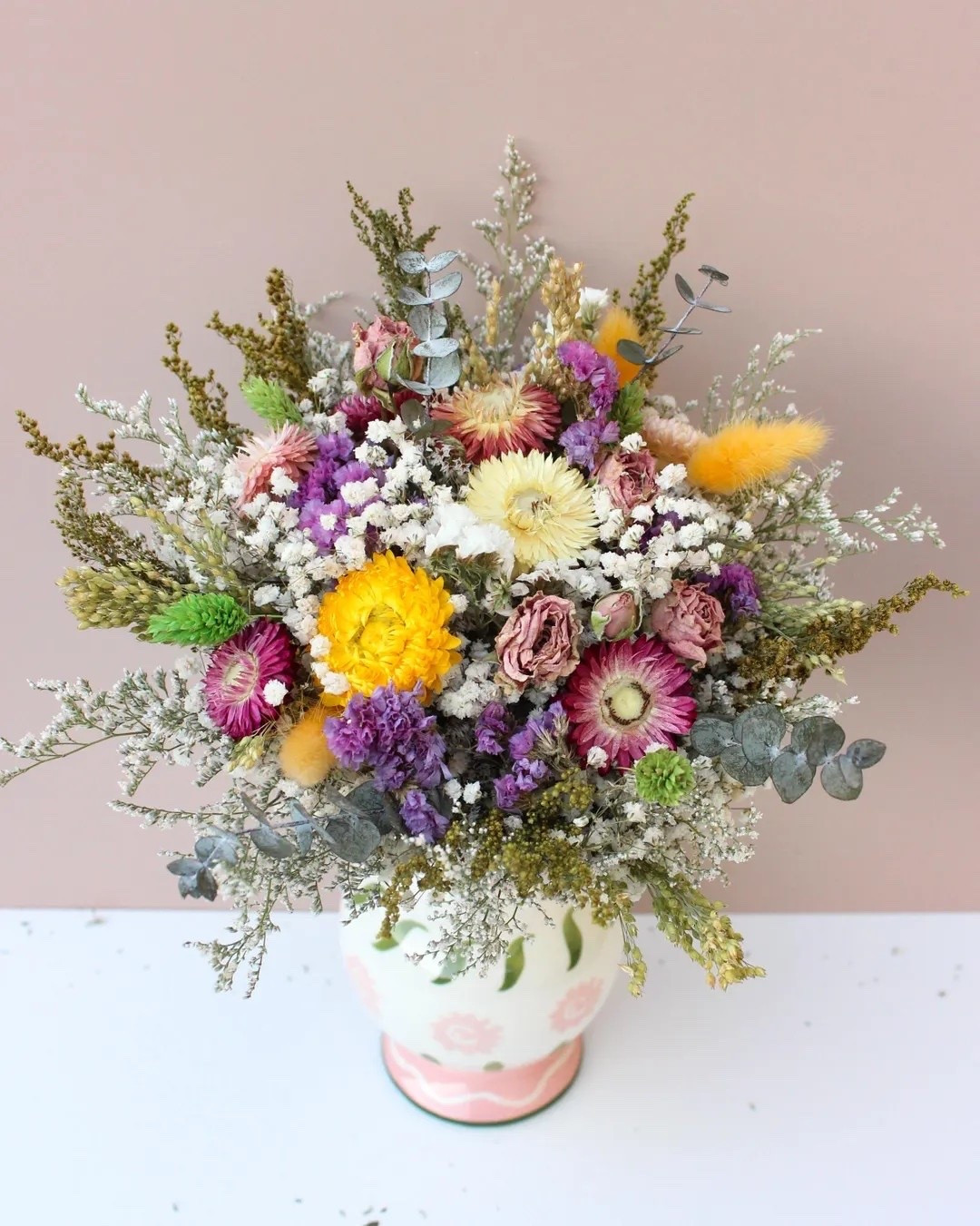 This romantic dried flower bouquet is filled with preserved roses, strawflowers, bunny tails, canary grass, purple statice, baby’s breath, and delicate meadow grasses for a soft, naturally elegant look. Perfect for weddings, bridal showers, baby showers, or adding a touch of everlasting beauty to your home. Available in multiple sizes and finished with your choice of twine, burlap lace, or ivory ribbon to match your style. #DriedFlowerBouquet #WildflowerBouquet #BridalBouquet #PreservedFlowers #BohoWedding #WeddingFlowers #EverlastingFlowers #RusticDecor #LTKWedding #FloralInspiration

#LTKWedding #LTKHome #LTKSeasonal