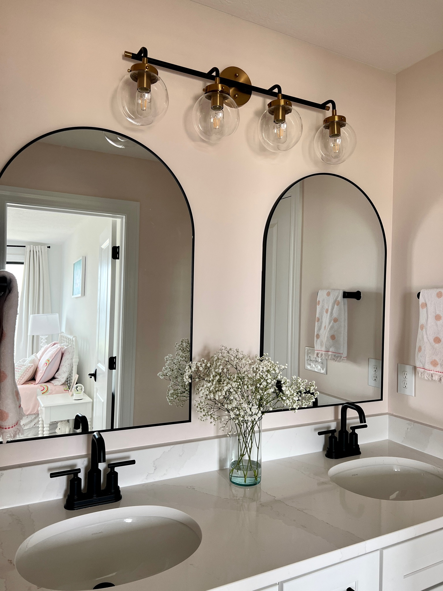 girls bathroom refresh 🩷 

arch mirror, mix metals light fixture, transitional bathroom, industrial chic 

#LTKhome #LTKsalealert #LTKunder100