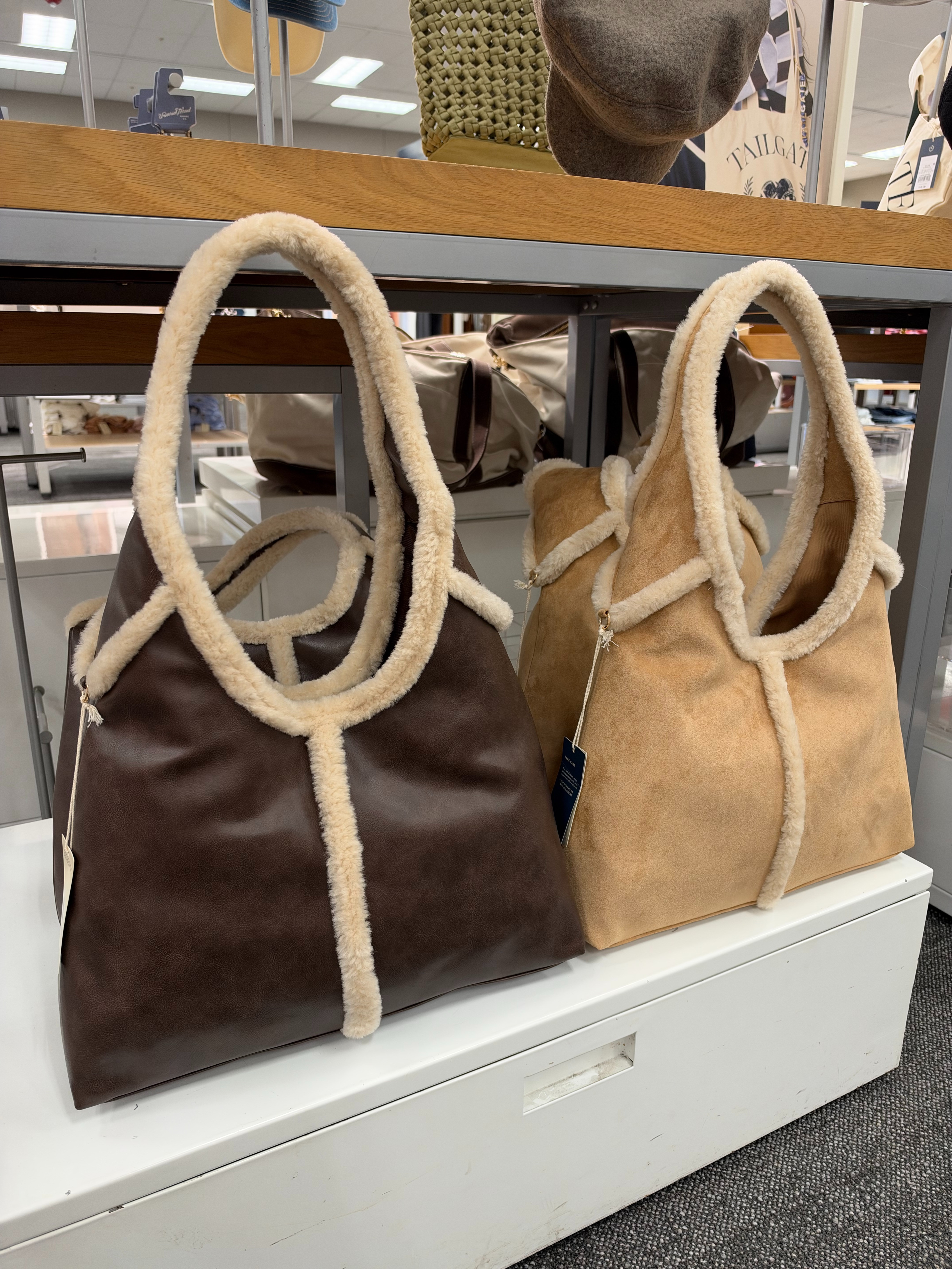Target fall handbags are giving designer-inspired vibes! These oversized shearling trim tote bags are the perfect cozy accessory for fall and winter, featuring faux leather and suede-look finishes in gorgeous neutral shades. Loving both the chocolate brown and tan for everyday outfits, work bags, and weekend errands! Which color would you pick? Tap to see the details and find your favorite! fall outfits women over 50, fall wedding guest dresses, fall dresses, wedding guest dress summer, date night outfits, fall fashion hauls, halloween decorations, fall decor, fall shoes, country concert outfits 

 #LTKdayinmylife #LTKgrwm #LTKootd