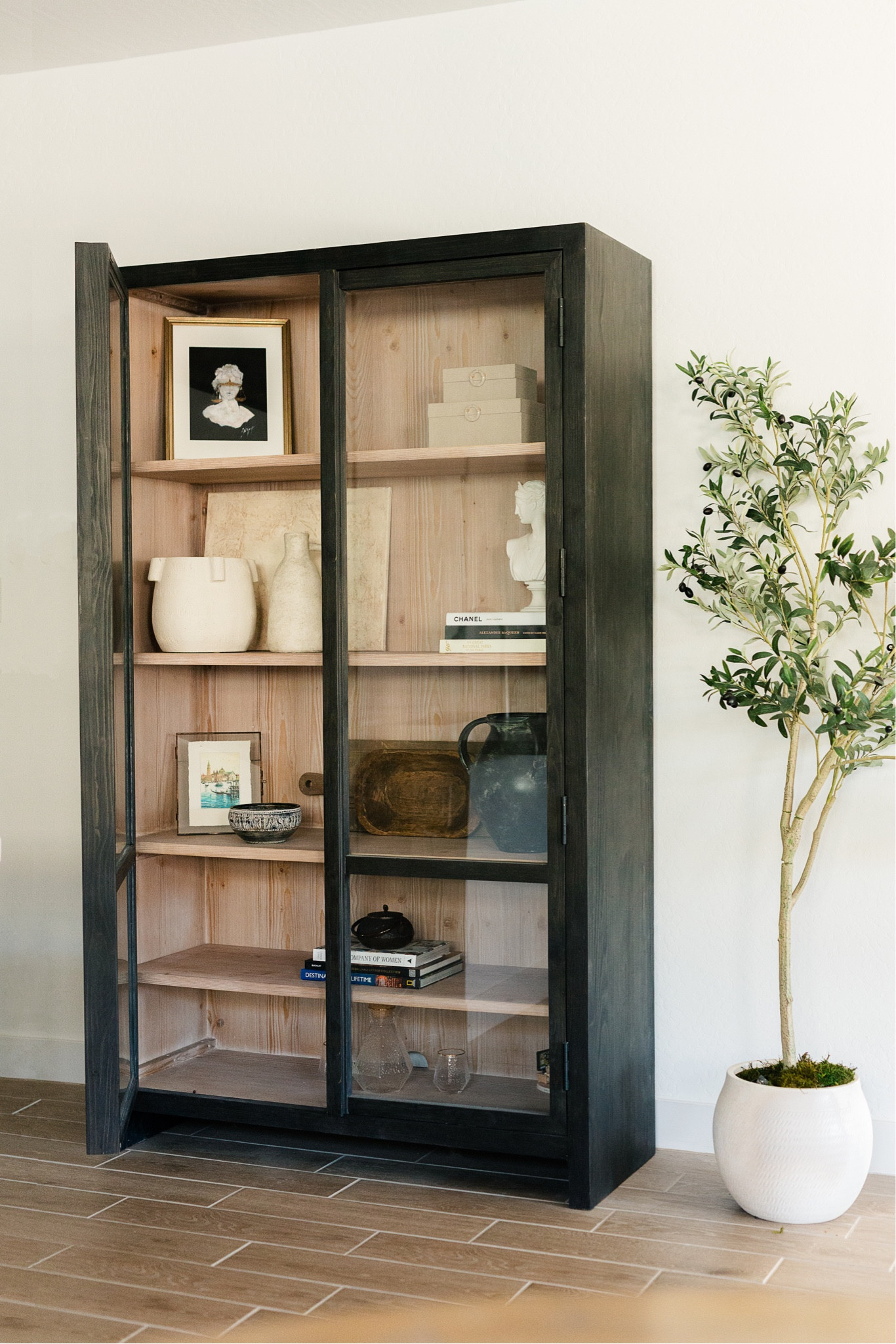 This gorgeous cabinet was a seriously lucky find at the Pottery Barn Outlet! My mom was visiting, and we both blacked out when we saw it. I’ve been looking for a way to display a few of my travel souvenirs, and it was a match made in heaven! This is one of those timeless pieces that I’ll keep for a really long time, I can’t wait to see how it holds up. 

#LTKhome
