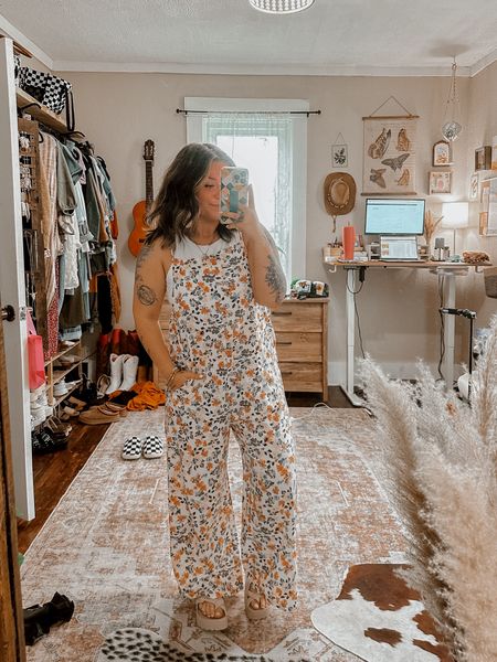 Viral amazon jumpsuit! Super cute casual floral boho jumpsuit overalls. Wearing medium in overalls and in tank. Platform soft sandals run TTS. Gold disc dangle earrings. 

#LTKSeasonal
