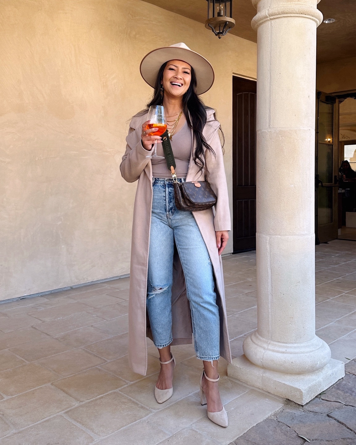 add a long coat and hat to a basic top and jeans outfit for an elevated day outing look. it’ll keep you warm but still look put together nicely. // resort wear | winter outfit | vacation outfit | jeans 

#LTKstyletip #LTKtravel #LTKsalealert