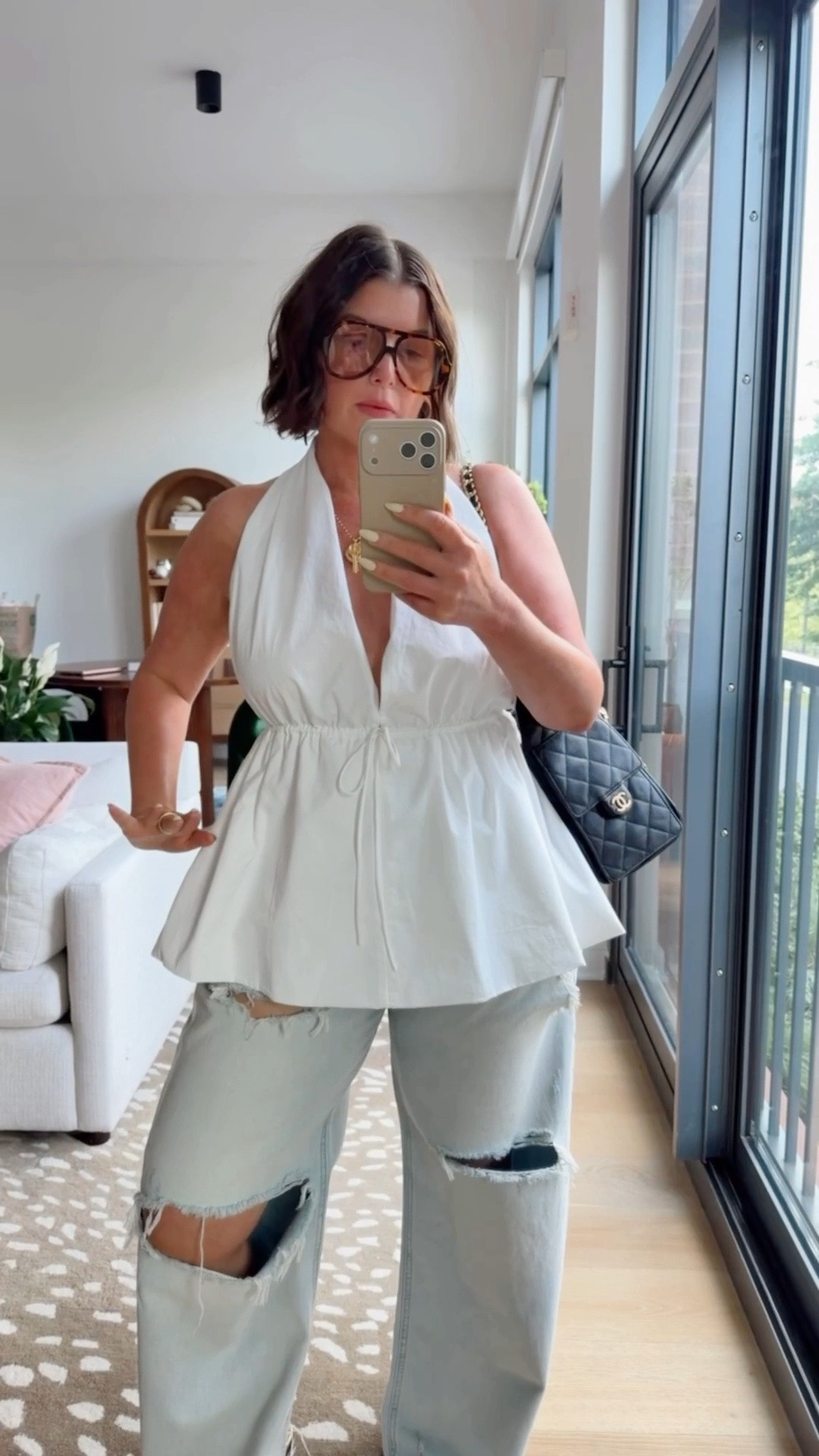 My elevated casual outfit of the day to run errands. Adding something special like this backless peplum halter top adds a feminine touch to the oversized distressed jeans.

The oversized frames add the effortless cool effect

#LTKootd #LTKgrwm