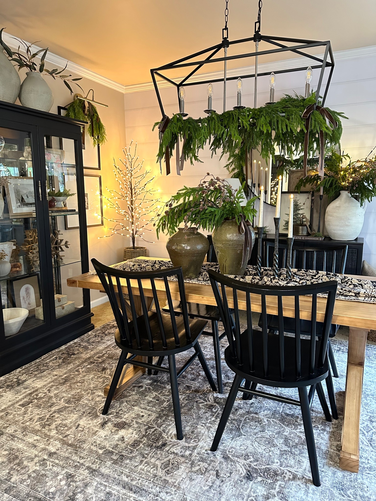 ✨🌲 Neutral Dining Room Views. Follow @farmtotablecreations on Instagram for more inspiration.

The addition of this gorgeous Whispers of the Balsam canvas artwork truly completed the look! It's one of my favorite designs I contributed to this season, displayed here in a 12x16 size with a black-stained frame. Don’t forget to use my code FARMTOTABLE for a 15% discount!

For reference: 
• 4 Norfolk Stems & 3 Pinecone branches were used inside vase on sideboard.
• 2 Norfolk Garlands on light fixture.
• Large framed artwork is size 24x24 with Briarsmoke Stain.

#christmas #christmasdecor #christmastime #christmasdecorating #christmashome #sideboard #neutralchristmasdecor #norfolkstems




#LTKHome #LTKFindsUnder50 #LTKSaleAlert