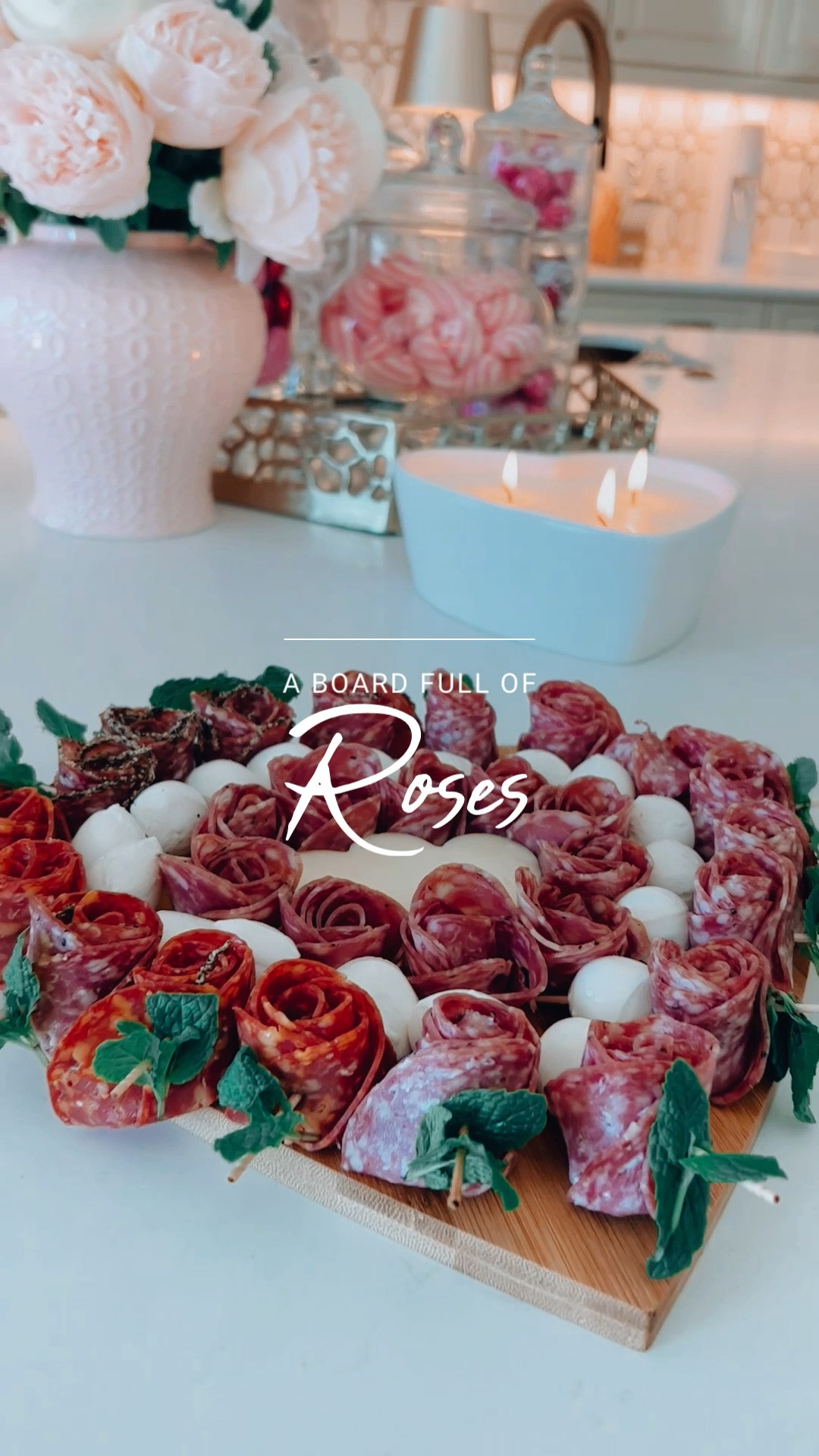 I created this romantic board using three different kinds of salame(in Italy, we call it so- will the E), mint, and mozzarella cheese. It’s better to have a small mint plant handy to choose the best leaves for your skewers. I placed them on a heart-shaped board, added a few roses without skewers in the middle, and placed provolone in the center(I used a cookie cutter to make it a heart). I took the video, and the food was gone in minutes! This platter is easy, delicious, and fun! I linked the board on my LKT page(it comes in three sizes, so I am using all of them for other projects as well). 🧡❤️
.
.
.
.
#charcuterieboard #charcuterie #charcuteria #charcuterieboards #charcutería #charcuterieplatter #charcuterietable #charcuterieplate #charcuterieplatters #cheeseboard #cheeseboards #cheeseboardsofinstagram #cheeseboardsfordinner #cheeseplategoals #cheeseplatter #cheeseplate #cheeseplatters #cocktailfood #cocktailfoods #skewers #cocktailskewers #valentine #valentinefood #valentinefoods #glamstyledecor #glamstylehome #glamstyleliving #glamdecorating #glamdecor #thefinerthings #thefinerthingsinlife 


#LTKSeasonal #LTKhome