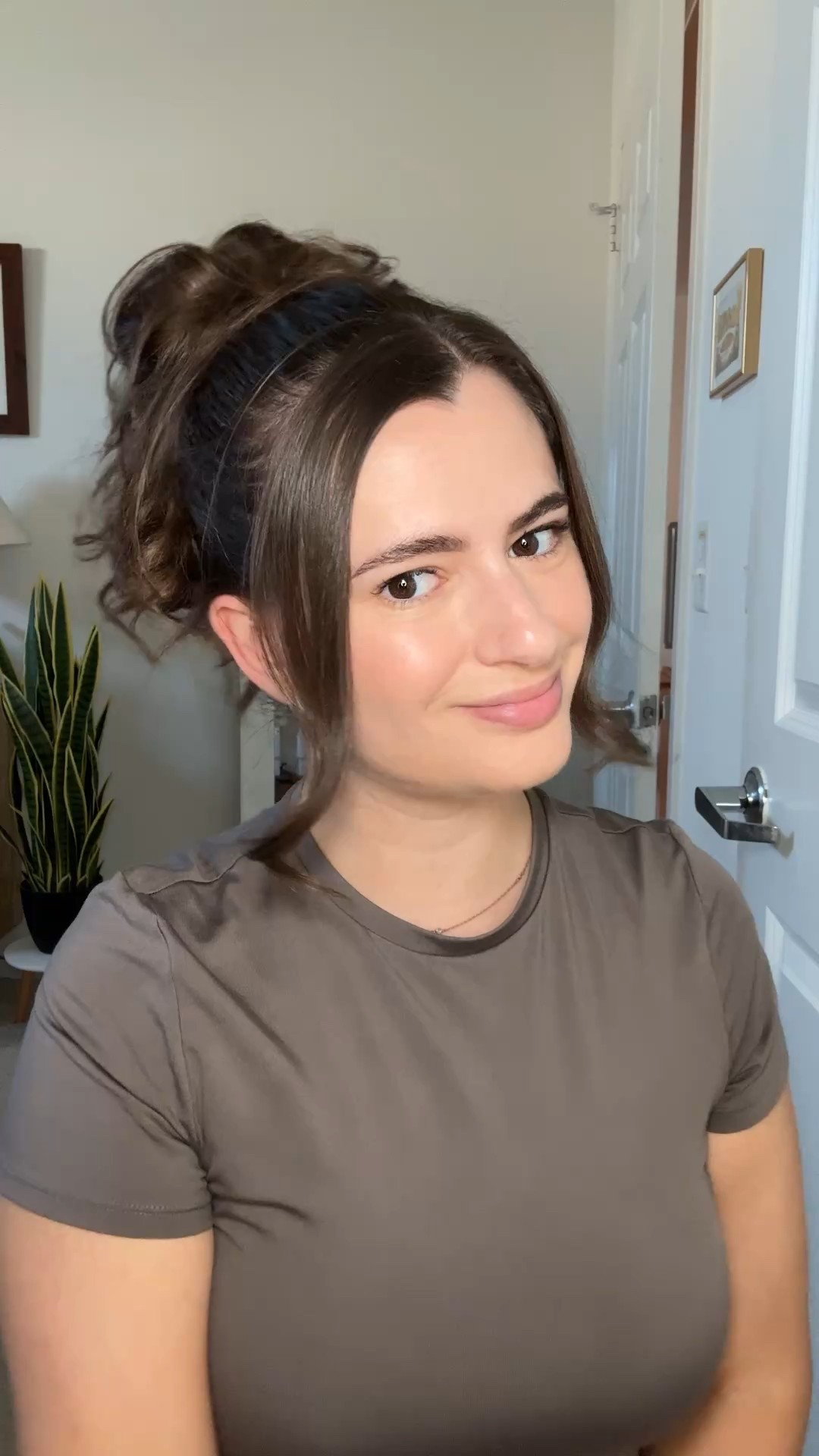 Quick and easy messy bun tutorial! First I curl my hair then pull it back into a high ponytail leaving two front pieces out. Then I use a clear elastic to secure the bun part. Love how fast it is!

#LTKBeauty #LTKFindsUnder50