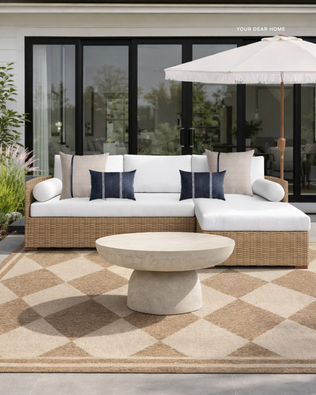 #ad, @wayfair, #wishyouwerehere, #outdoor, #Wayfair, #WayfairPartner.

A relaxed backyard patio setup that feels warm, neutral and inviting. The wicker sectional paired with the patterned outdoor rug and sculptural concrete coffee table creates an easy lounge space that still feels polished. The umbrella adds shade while the navy pillows bring just enough contrast to keep the palette interesting. Perfect for slow mornings or evening chats outdoors. 

 #LTKSeasonal #LTKHome