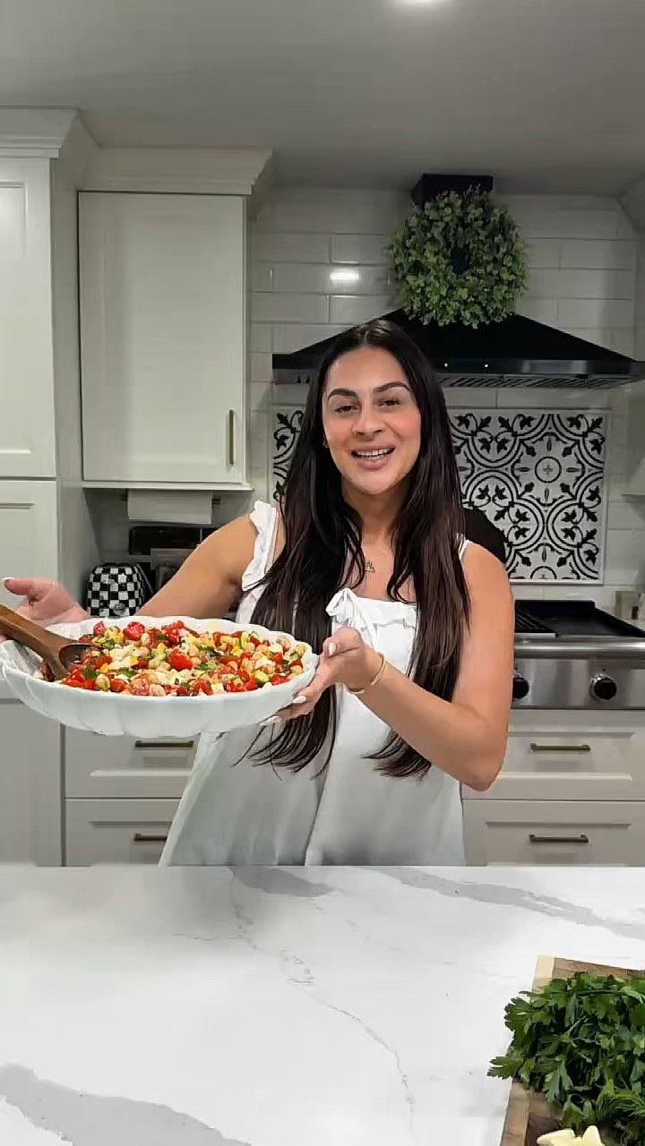 It’s grilling season, Here’s an easy, fresh chickpea salad recipe that’s perfect for a side dish. 

INGREDIENTS

* 2 cans chickpeas, drained + rinsed
* 1 cucumber, diced
* 1 bell pepper, diced 
* 2 cups cherry tomatoes, cut in quarters 
* ¼ red onion, finely diced
* 1 cup cubed mozzarella cheese (optional but so good)

DRESSING

* 3 tbsp olive oil
* 1/2 cup red wine vinegar
* 2 garlic cloves, sliced or minded 
* Salt + pepper to taste

Instructions

1. Add chickpeas, cucumber, tomatoes, red onion, mozzarella, peppers .
2. Mix together the olive oil, vinegar, salt, and pepper.
3. Pour dressing over salad and toss well.
4. Let it sit for 10–15 minutes so the flavors soak in (or eat immediately).

Easy add-ins depending on your vibe:

* Avocado for creaminess
* Grilled chicken for protein
* Bell peppers or olives for crunch/saltiness
* Quinoa if you want it more filling

It tastes even better after chilling in the fridge for a few hours. 💛

#LTKmomlife #LTKfoodie #LTKvlog