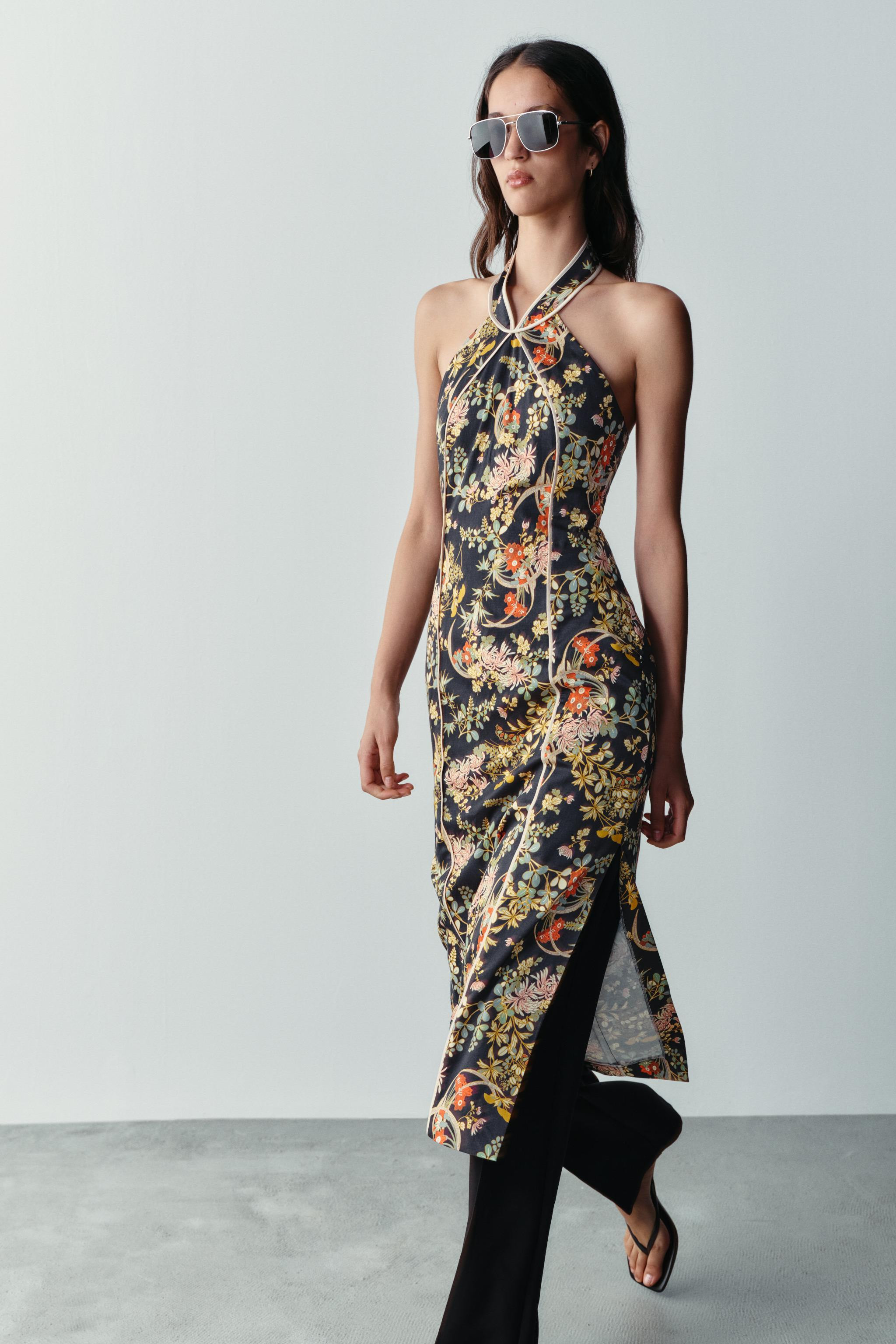 Fitted halter neck dress with defined piping detail. Side slit at the hem. Concealed back zipper ... | Zara US