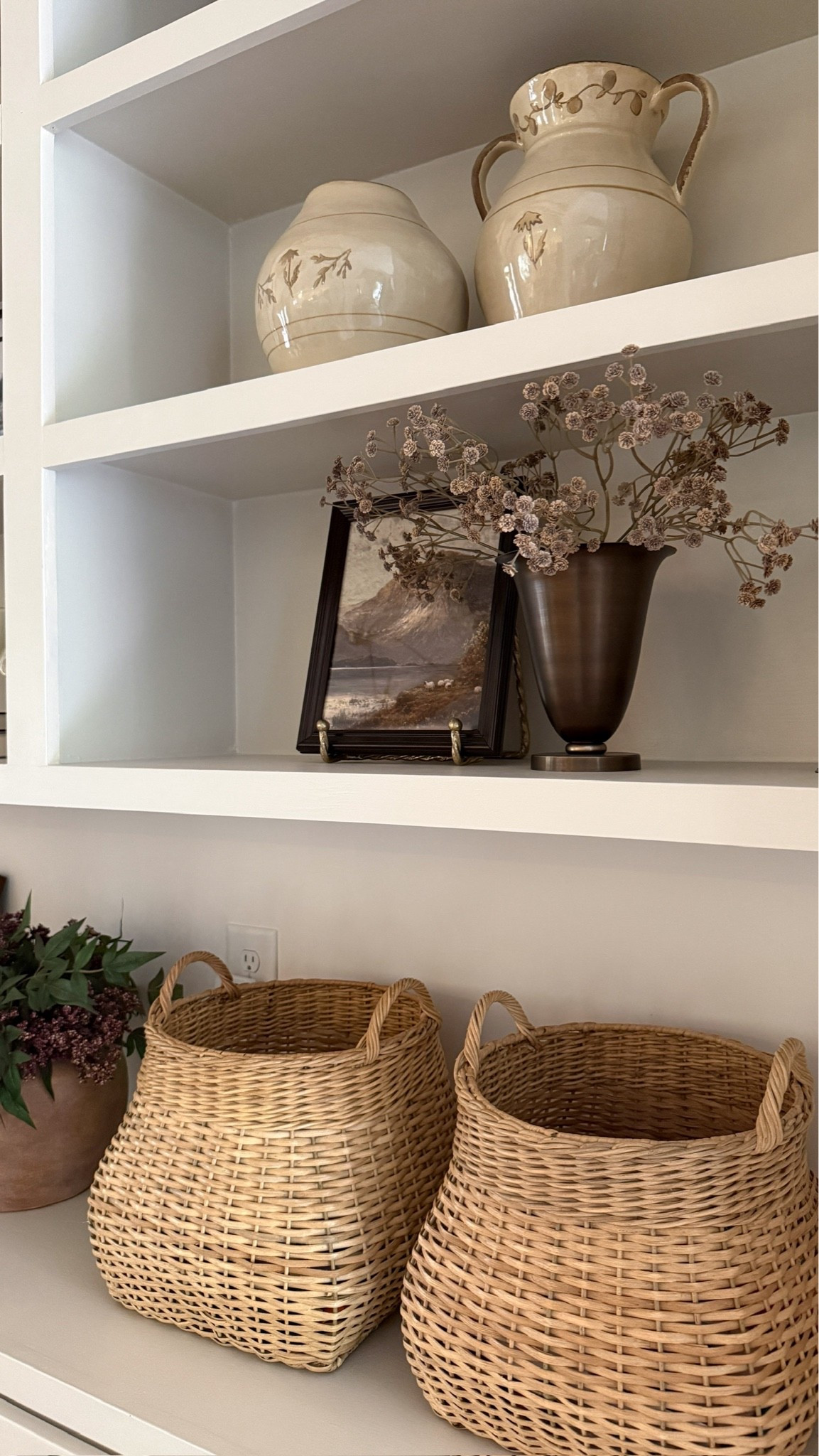 The coziest fall decor on our built-in shelves 🍂 From moody art to seasonal stems and woven textures, this is my go-to recipe for curated shelf decor. 🤩🤎

#LTKHome #LTKSeasonal