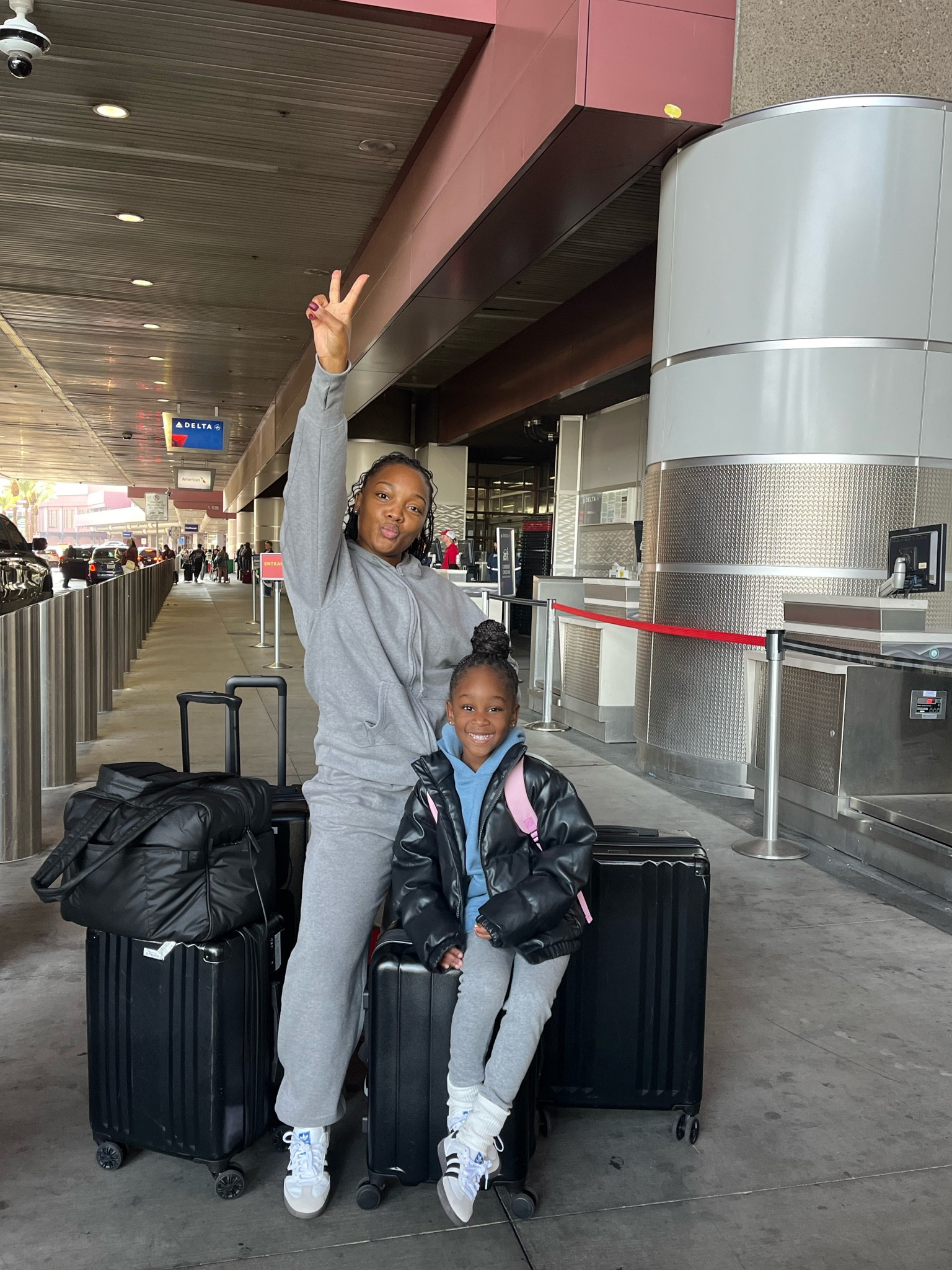 Coordinating mommy and me airport outfits.

Grey sweatsuits. Sambas. Adidas. Kids hoodies. Luggage. Black suitcases. Travel gear. 

#LTKtravel #LTKkids #LTKstyletip