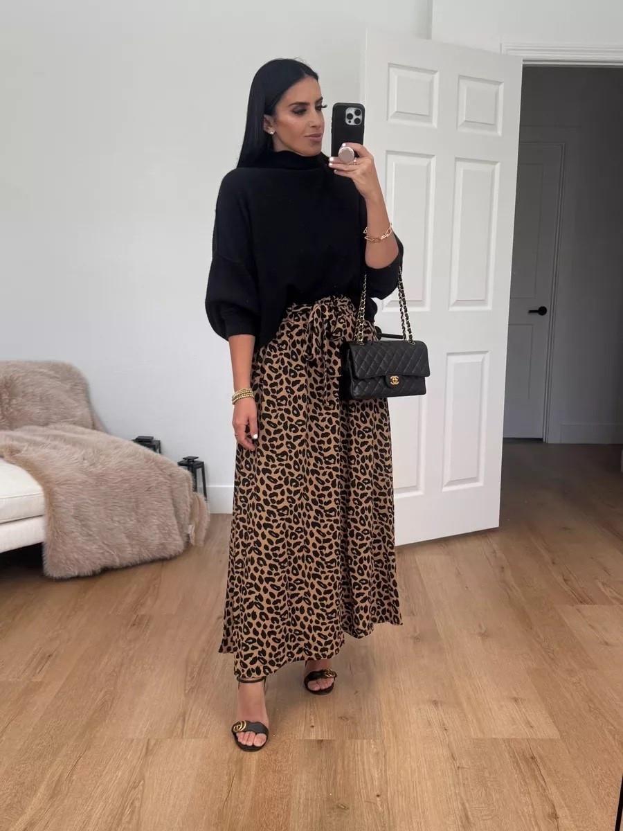 Leopard print mxi skirt from Amazon under $30. Black turtleneck sweater. Gucci heels

