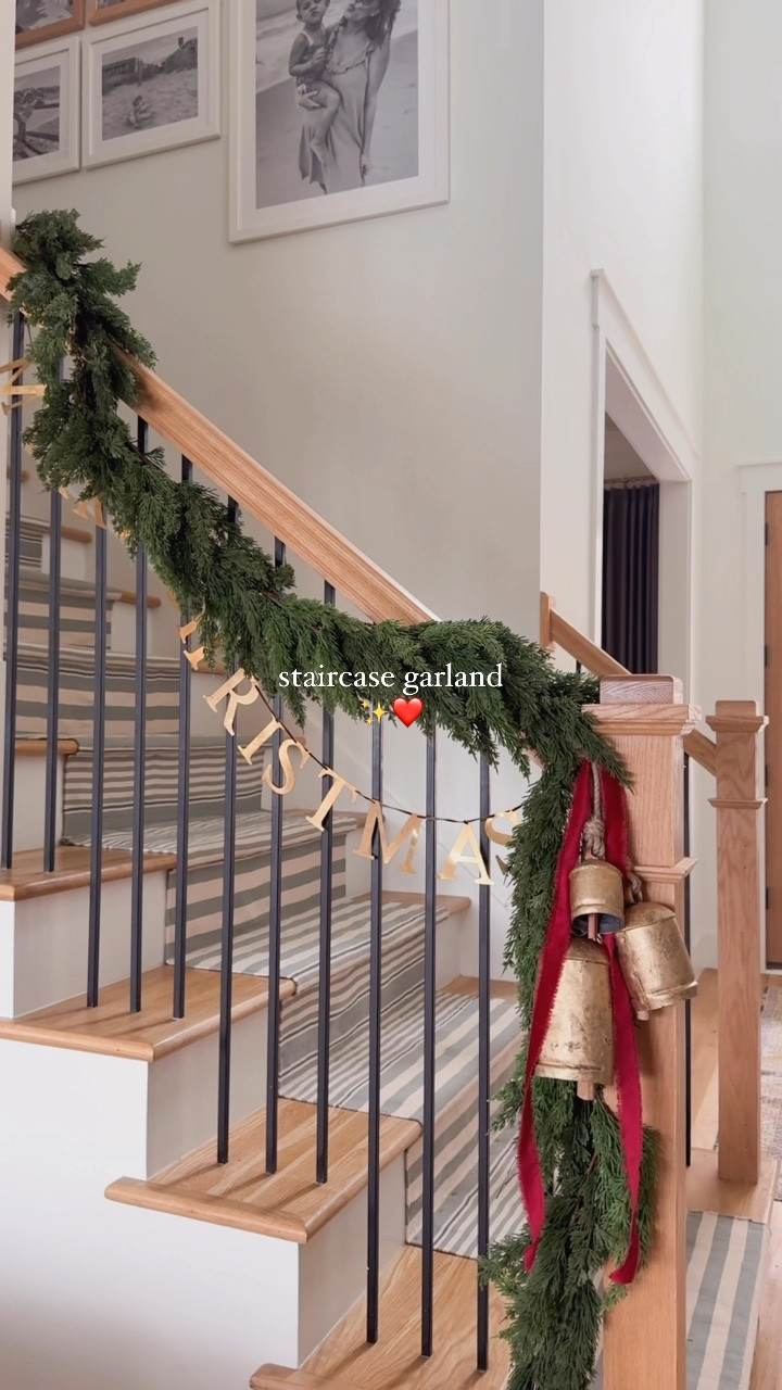 staircase garland with @afloral ✨ | this is the 108”Deluxe Cedar Garland, it’s lush and lifelike with a beautiful timeless look, add bells + velvet ribbon to create an elevated look ❤️ #afloral #afloralgarland 

save + share for inspo 🌲
#christmas #christmasdecor #garland #christmasdecorations #staircase #nostalgia #christmastime #tistheseason #neutralhome 

#LTKHome #LTKHoliday #LTKSeasonal