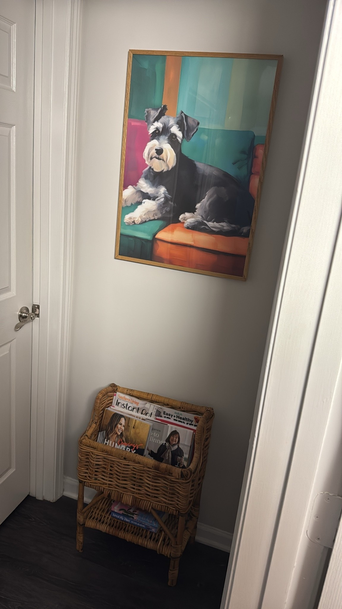 I got tired of staring at the breaker box at the end of this hallway and snagged some art of my dog large enough to cover the box. This rattan magazine rack is thrifted but linked to a similar vintage find.

#LTKSaleAlert #LTKHome