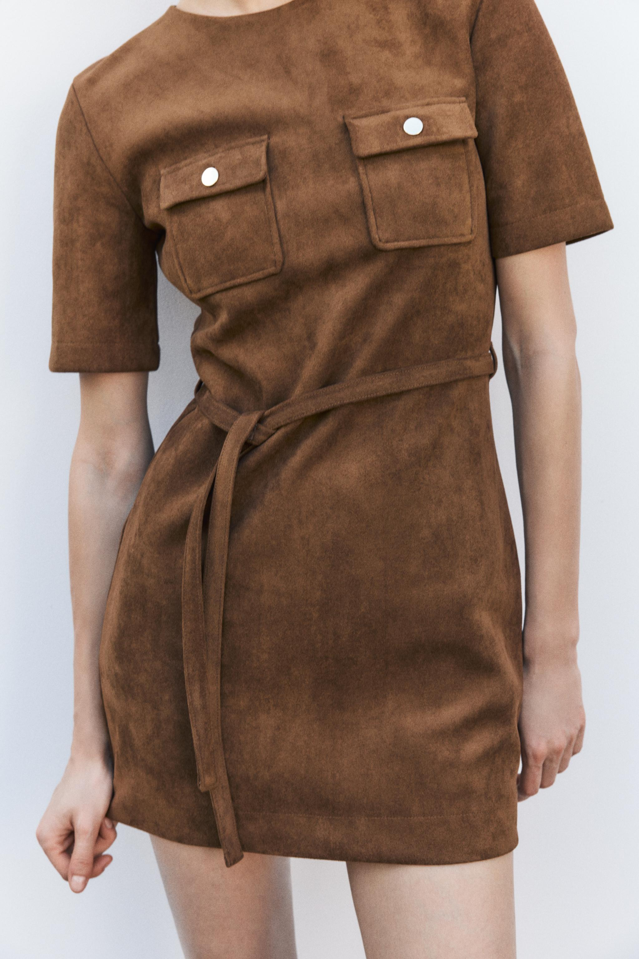 Short round neck dress with short sleeves. Front patch pockets with buttons. Self-tie belt. Back ... | Zara US