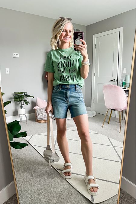 Casual mom outfit with jean shorts and a graphic tee. 
T-shirt- xs
Shorts- 0
Sandals- 7

#LTKfindsunder50 #LTKstyletip #LTKSeasonal