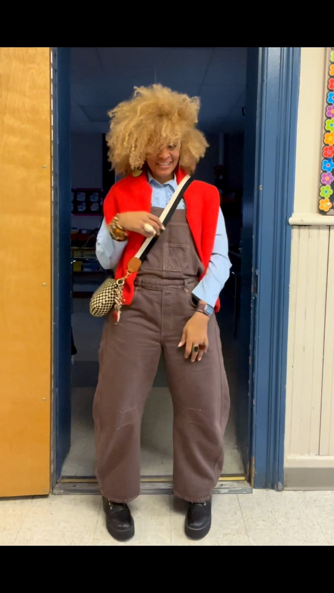 Sometimes, all it takes is a simple pop of color to transform an entire look! 🧡 This bold orange accent not only brightens my outfit but also boosts my mood. Whether it’s a scarf, bag, or accessory, don’t underestimate the power of color in your wardrobe. It’s amazing how a splash of orange can turn a casual ensemble into something eye-catching and fun! 

#OOTD #styleinspo #StyleTransformation #teachersofinstagram

Sweater: @urbanoutfitters
Shirt: @Zara zara
Overall: @freepeople
Boots: @hm
Bag: @shopclarev 
#SupportSmallBusiness
Earrings: @nappyrutz (use code STORY) 
Bracelets: @beadit_  ( IG)
Rings: @hellobaabs (use code STORY20) 


#LTKootd #LTKWorkwear #LTKSaleAlert