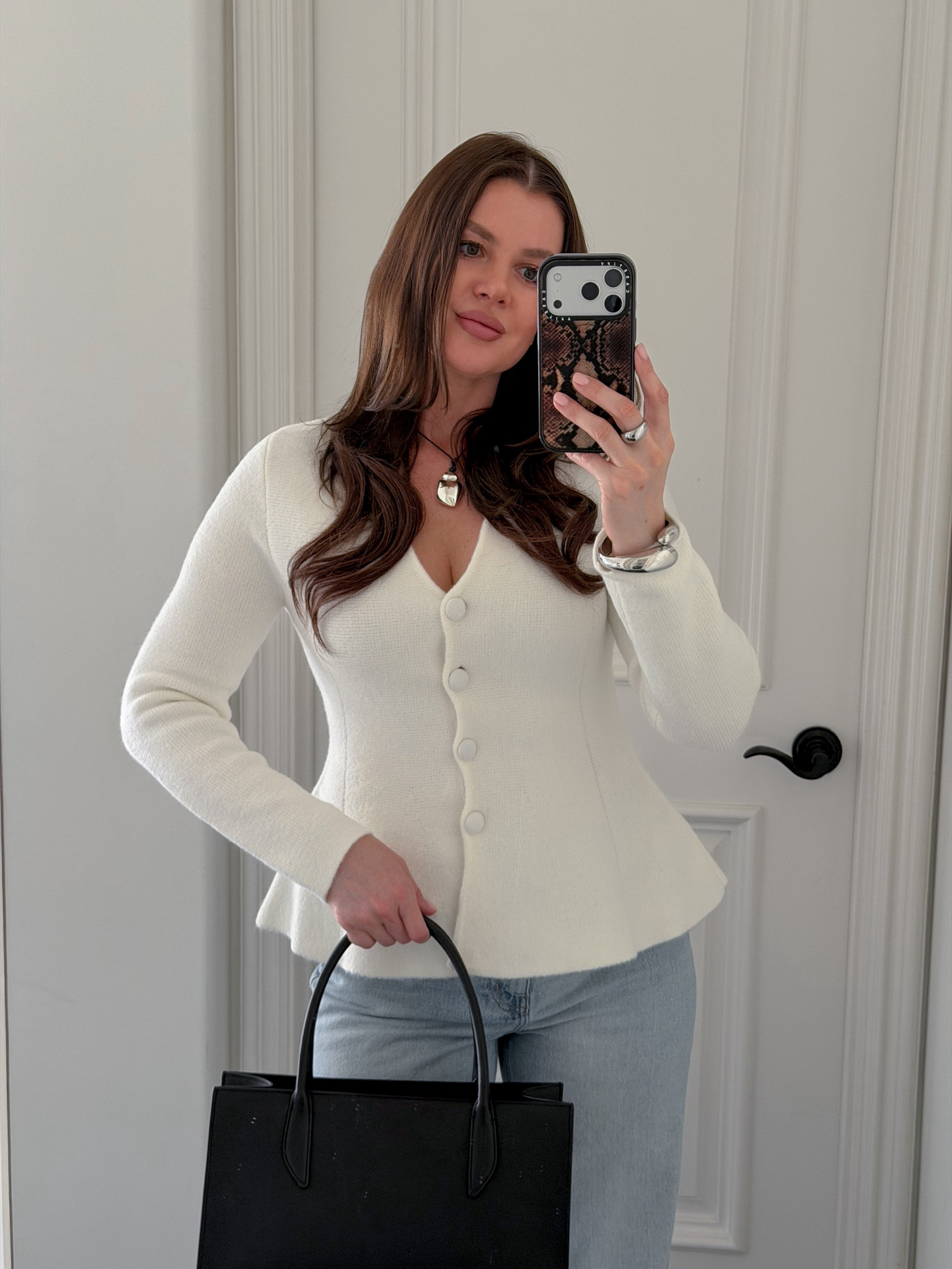 Styling white structured sweater with wide leg jeans, black sling backs and a black mini tote. Adding silver jewelry to elevate the look. This sweater is perfect for the office or a casual brunch date. Wearing size S. Fits true to size 
#sweater #strucktured #workwear #officeoutfit #springoutfit #brunchoutfit 

#LTKootd #LTKWorkwear #LTKgrwm