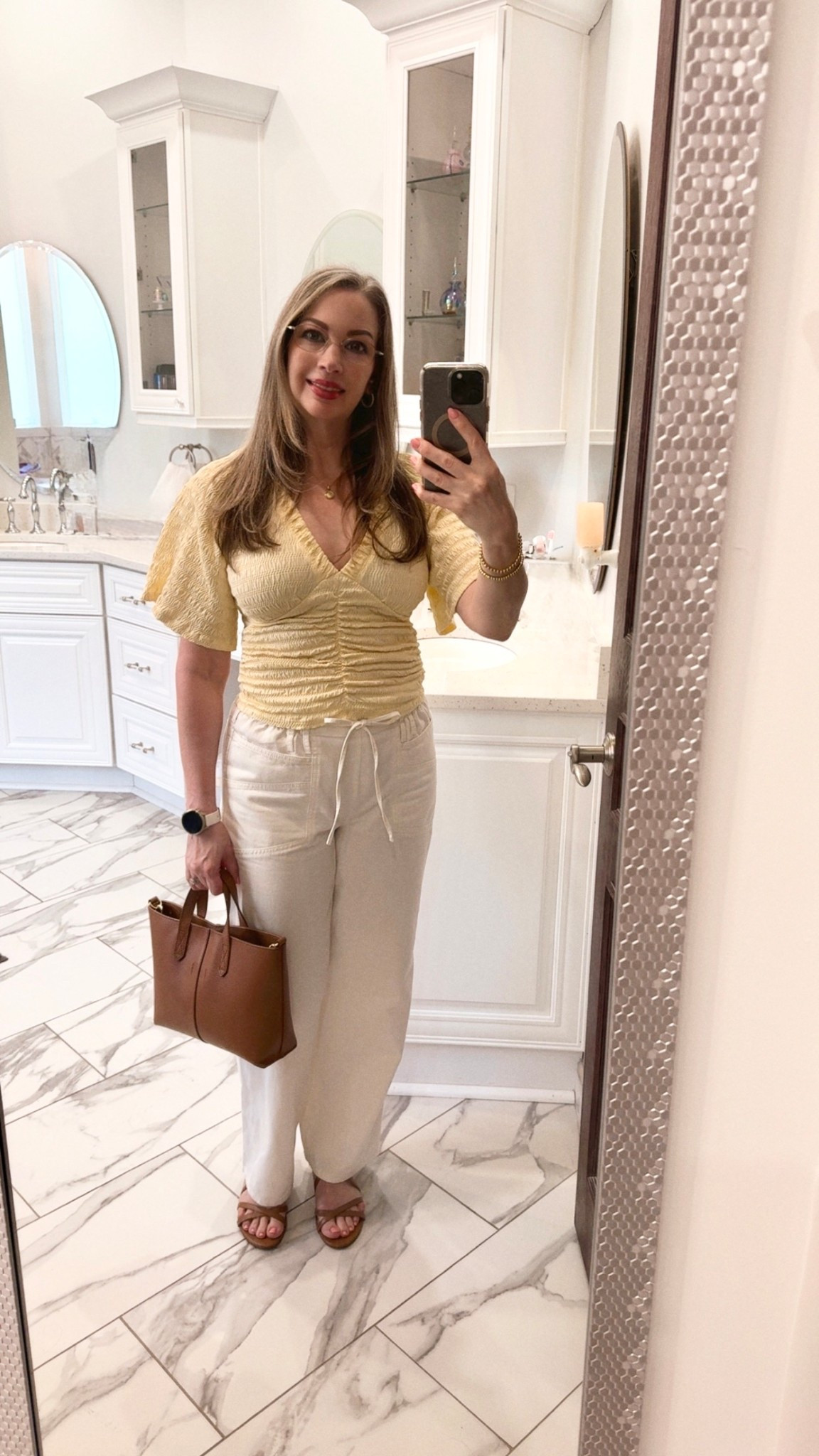 ￼ I always get excited when you pick out versatile pieces that you can wear in so many different ways. I absolutely adore my butter-yellow top combined with my cream paper bag pants, and my tan handbag and sandals. These items are getting a lot of wear from my spring capsule wardrobe 💛

#LTKootd #LTKWorkwear #LTKPetite
