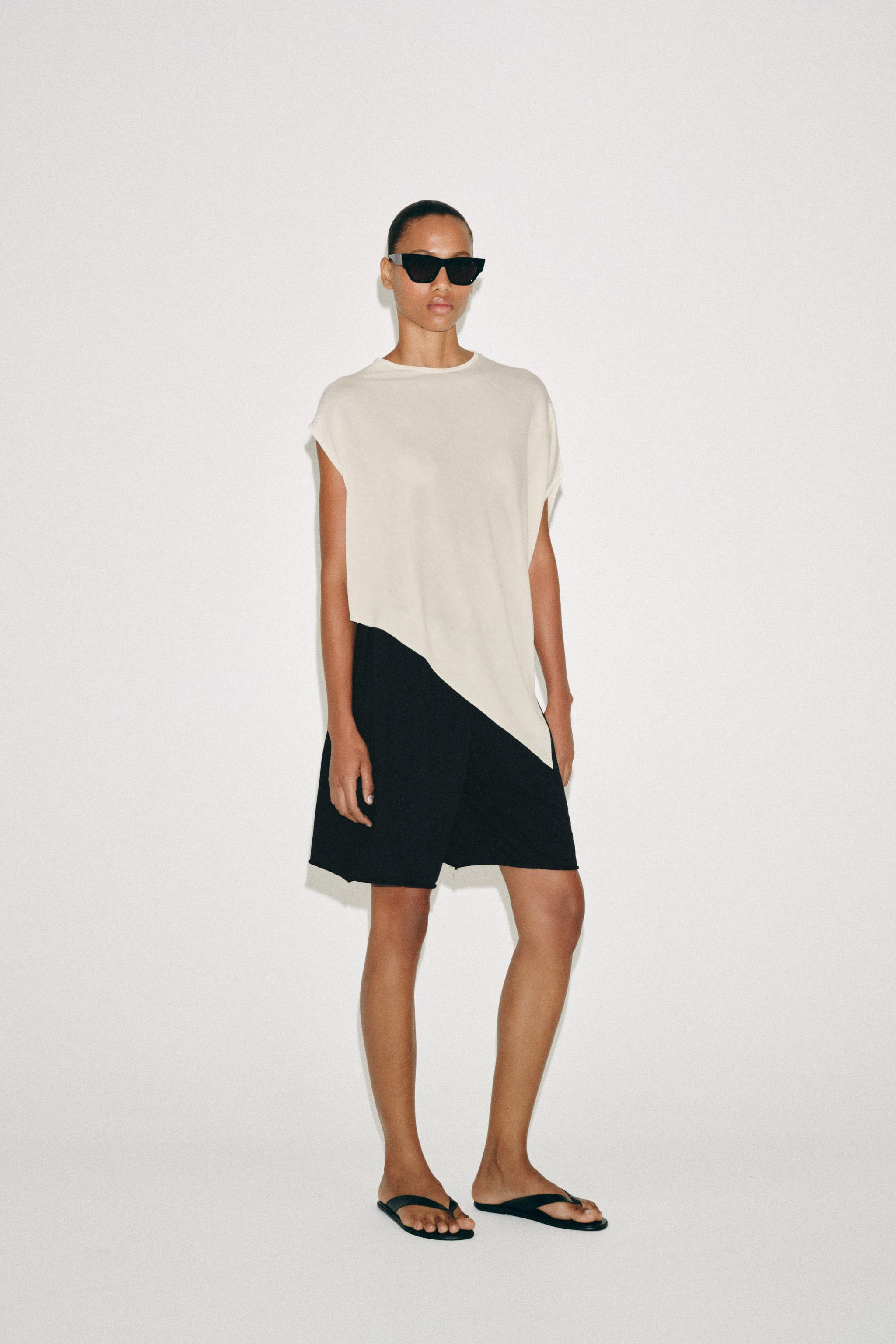 Flowy round neck top. Asymmetric sleeves and hem. | Zara US