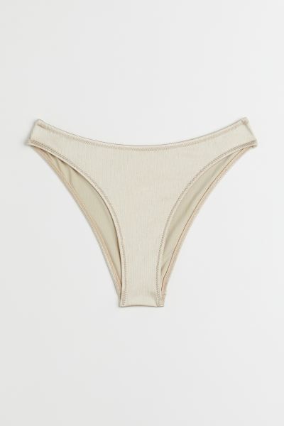 Conscious choice  New ArrivalFully lined bikini bottoms with a textured finish. Regular waist and... | H&M (US + CA)