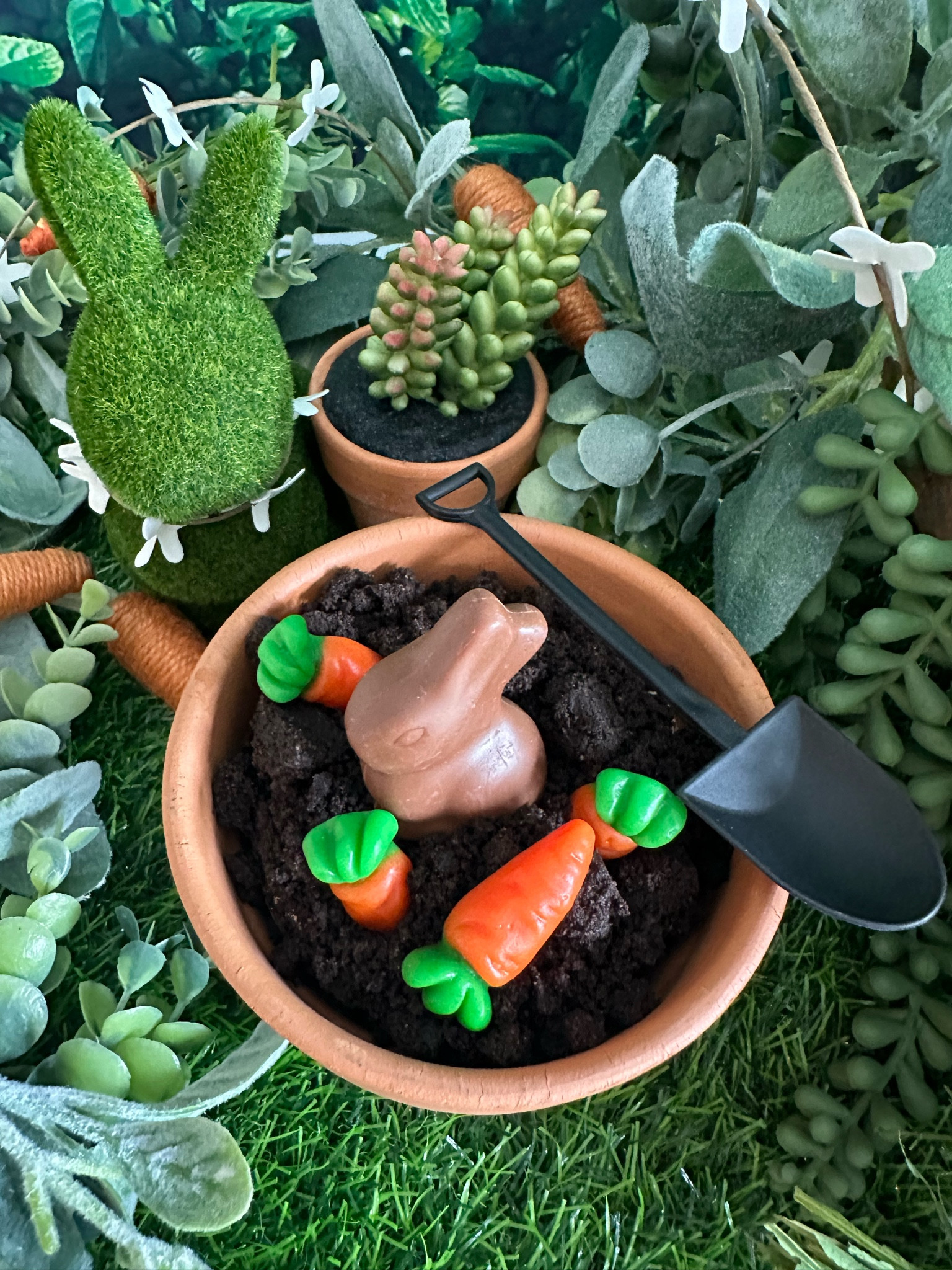 Spring inspired dirt cake placed in a clay pot with a shovel spoon. 

#LTKFind #LTKunder50 #LTKSeasonal