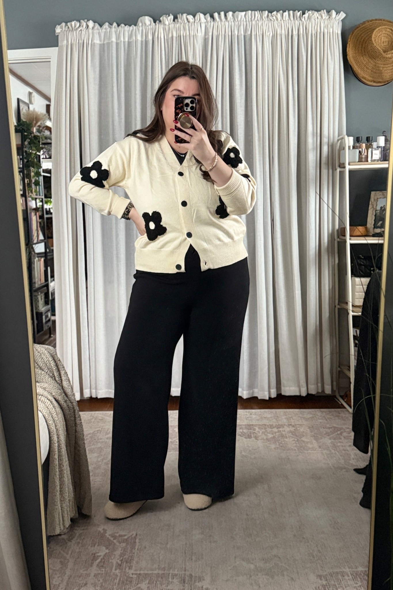 Today’s WFH look is a mix of soft textures and minimalist neutrals: an ivory floral cardigan, a black mock neck double-lined top, and ribbed wide-leg pants. This combo looks elevated on camera but feels like loungewear IRL. I finished it with Kate Spade pearls, my Apple Watch resin band, and Bombas slippers for maximum comfort at my desk.

#LTKootd #LTKWorkwear #LTKgrwm