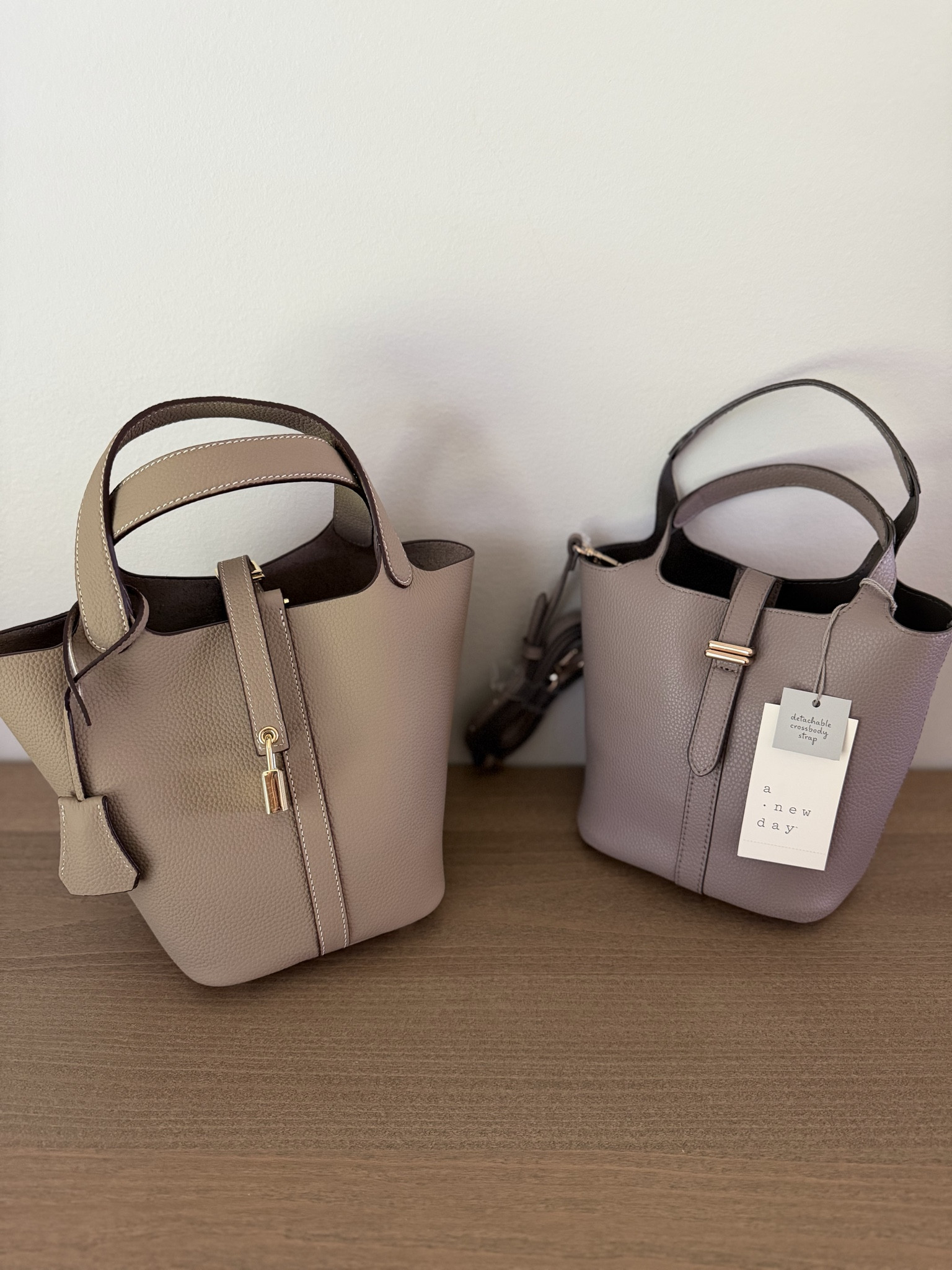 Two really great handbag options! Besides the price, the biggest difference is that the Amazon one (left) is slightly bigger and comes with a removable pouch with pockets, and the Target one (right) has a removable shoulder strap.