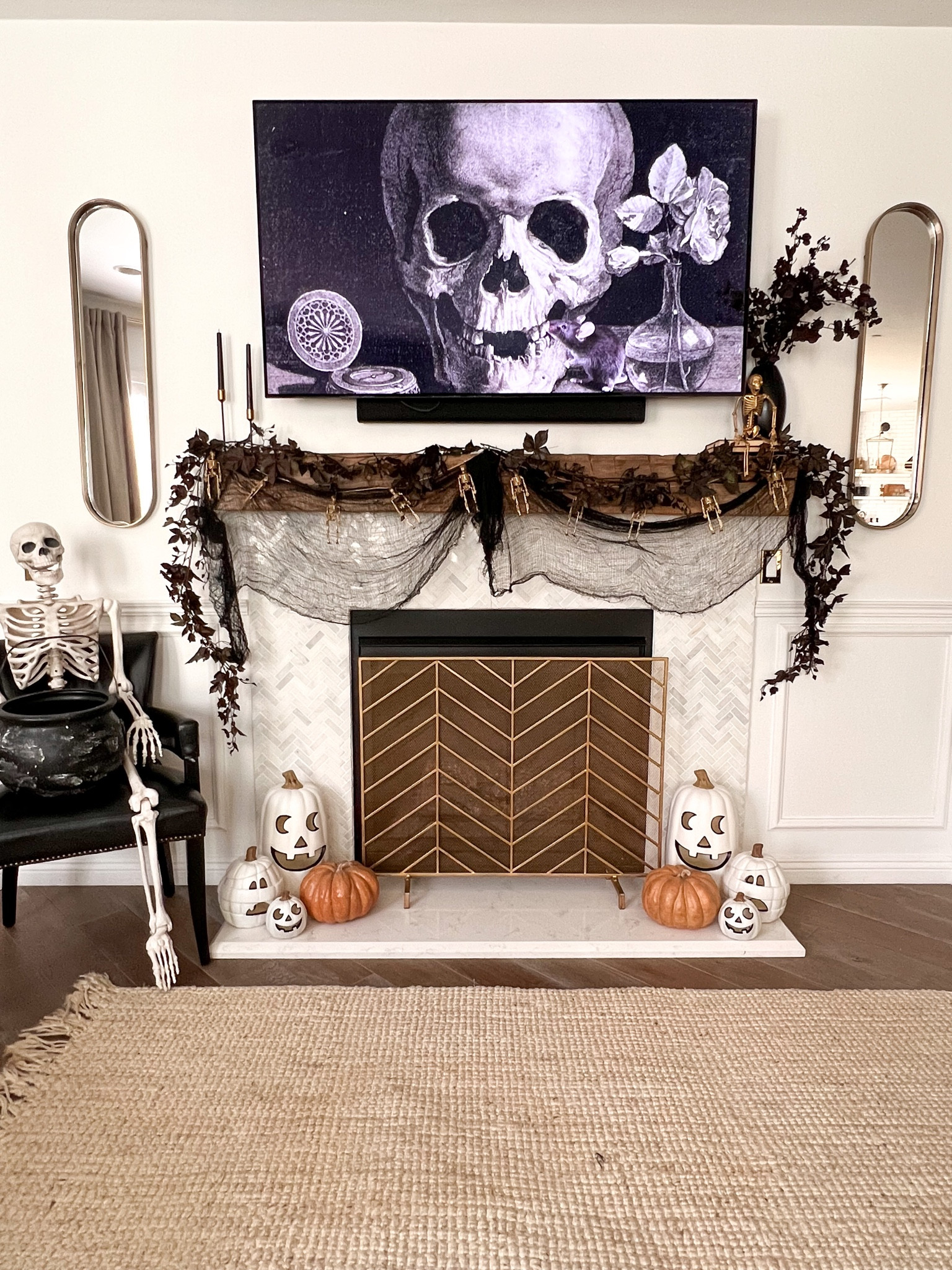 Halloween decor in the living room

Halloween fireplace
Fall garland
Halloween living room
Fall home
Faux pumpkin
Mantle
Mantel
Skeleton decor 

#LTKHoliday #LTKHalloween #LTKfamily