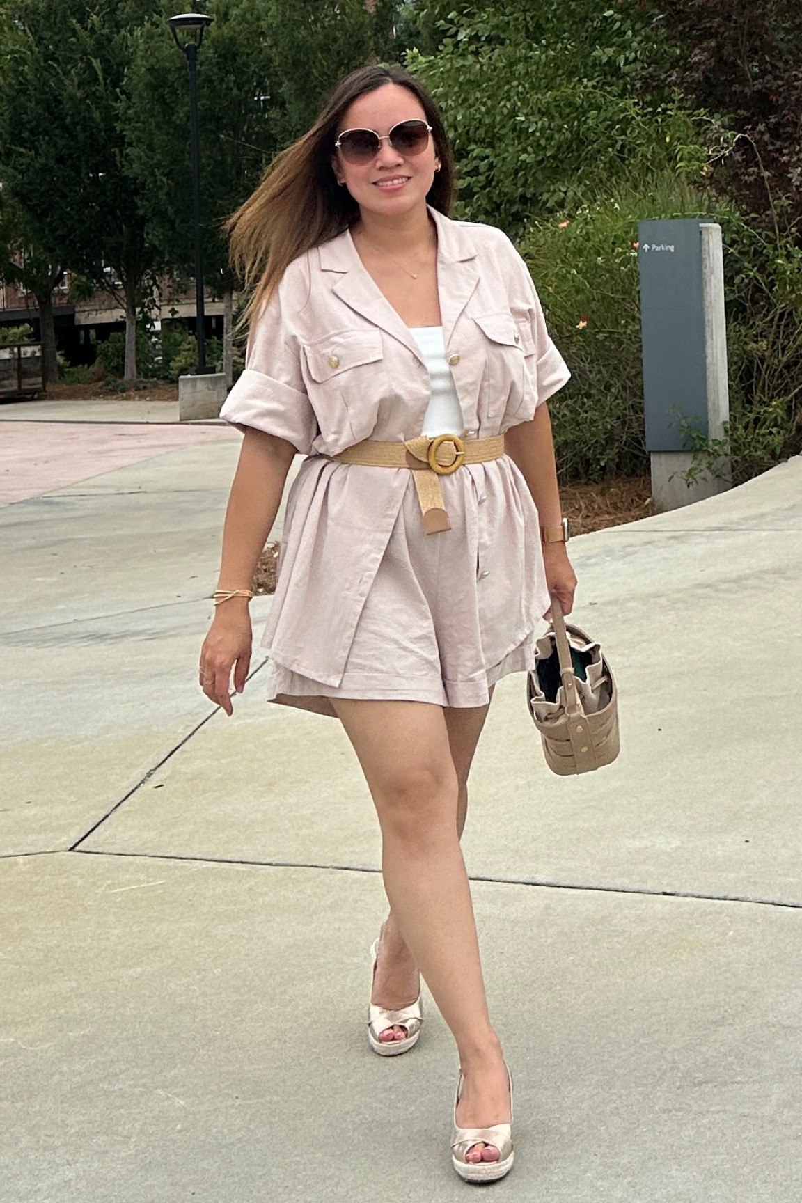 The oversized button-down shirt and wide shorts in apricot create a chic yet relaxed vibe, perfect for a casual warm weather outfit. Pairing them with a wide straw belt adds texture and defines the waist beautifully. The wedge sandals elevate the look with both style and comfort, while the bucket bag ties everything together with a touch of effortless sophistication. It's a well-coordinated ensemble that exudes effortless summer elegance.

#LTKmidsize #LTKstyletip