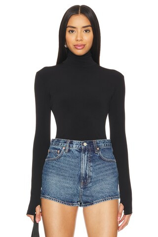Norma Kamali Slim Fit Long Sleeve Turtleneck Top in Black from Revolve.com | Revolve Clothing (Global)