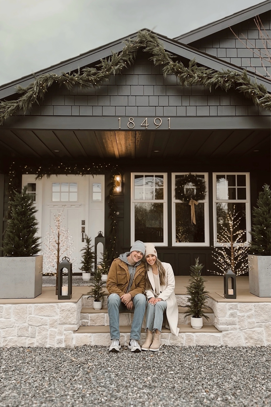 2024 Christmas front porch 🌲✨🌿 This year we added lots of faux garlands, trees + twinkle lights to give our exterior a magical glow for the holidays! 

#LTKHoliday #LTKHome #LTKSeasonal