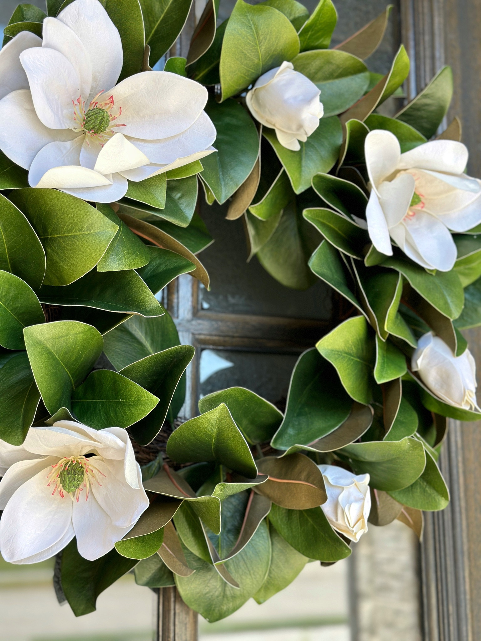 Faux magnolia wreath front porch decor 

#LTKhome #LTKsalealert #LTKSeasonal