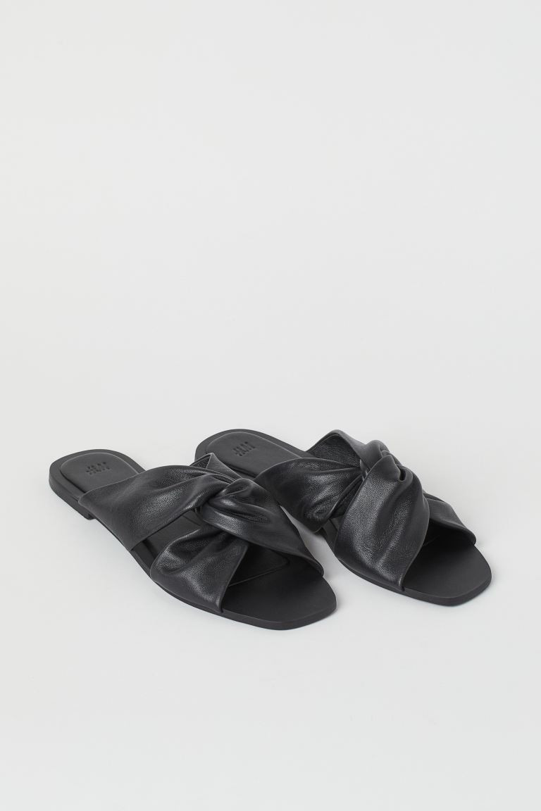 Leather slides with wide foot straps at front with a twisted detail. Leather lining and insoles. ... | H&M (US + CA)