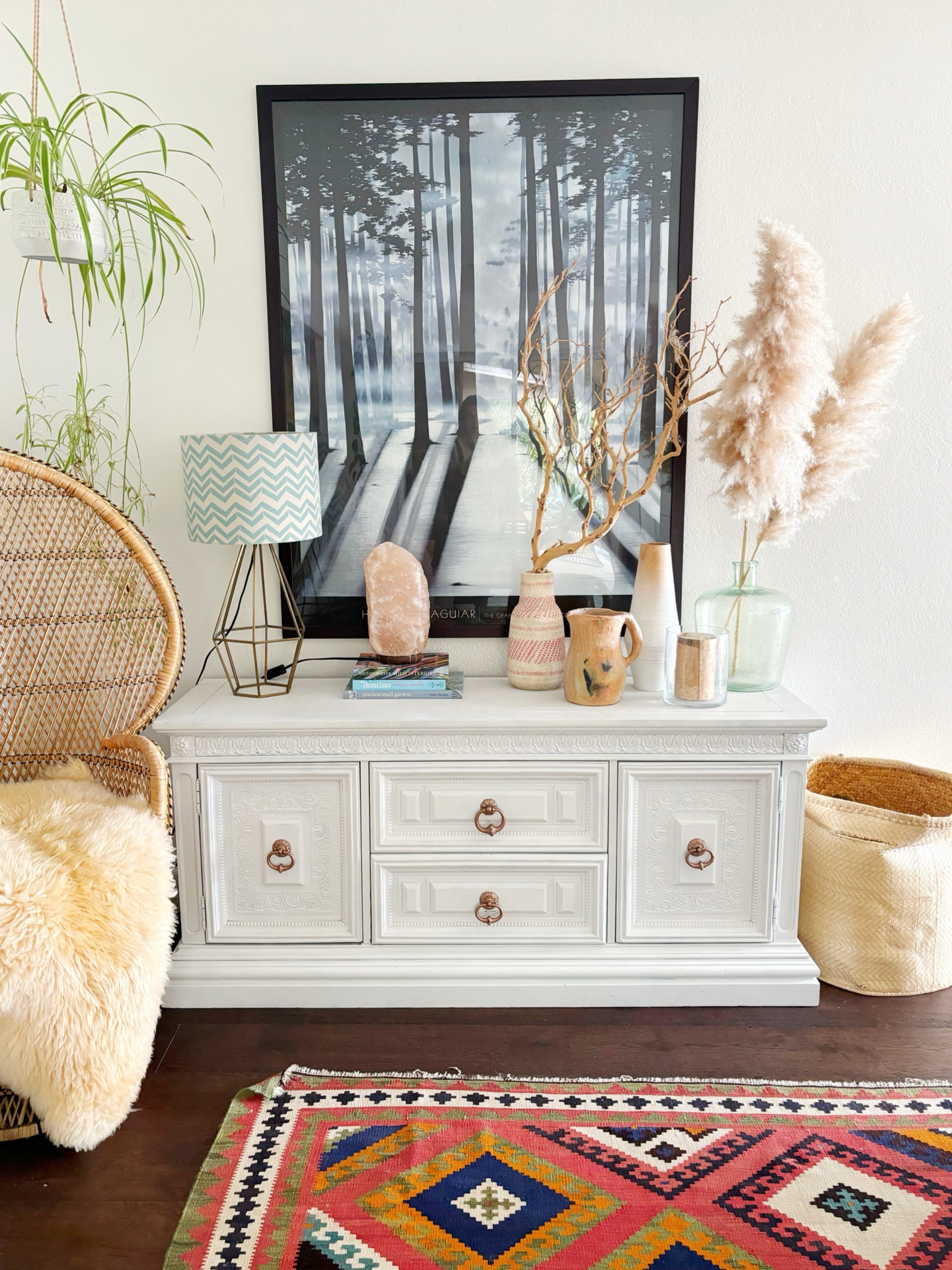 Here is my console styling without me standing in front. 😆 the console, rug, and sheepskin were all garage sale or Craigslist finds.  I love my salt lamp for a moody vibe at night and different size collected jars and vases.  

#LTKfindsunder100 #LTKover40 #LTKhome