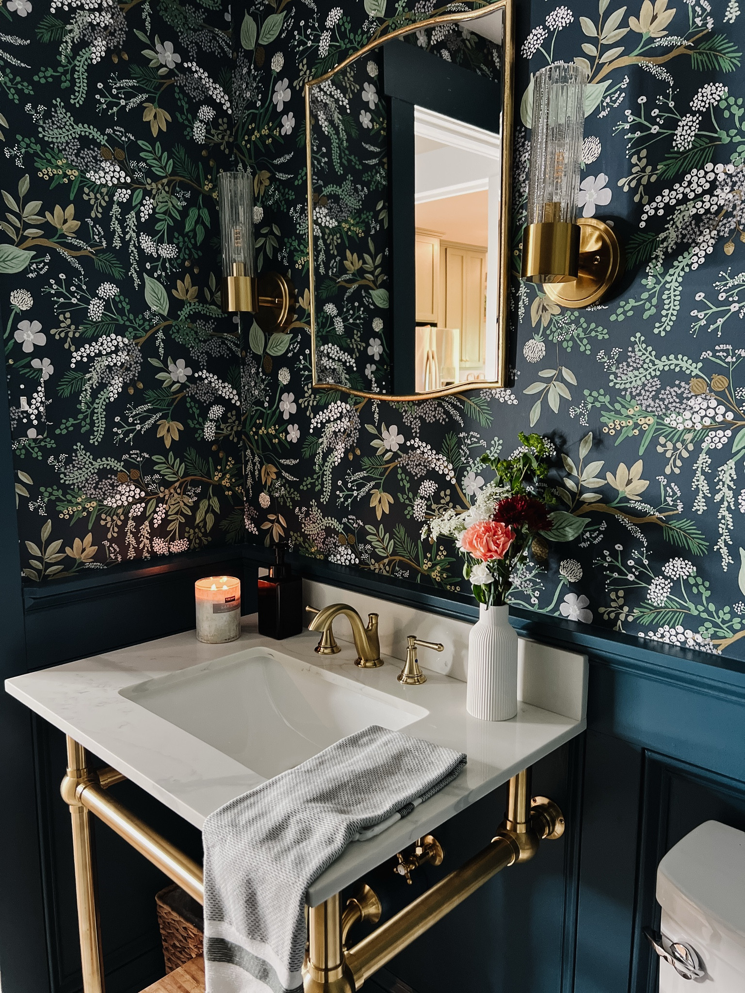 Modern vintage powder bath with bold colors and beautiful wallpaper. The timeless quartz counter in the brass console sink base is my favorite statement pieces in this bathroom. 

#LTKHome
