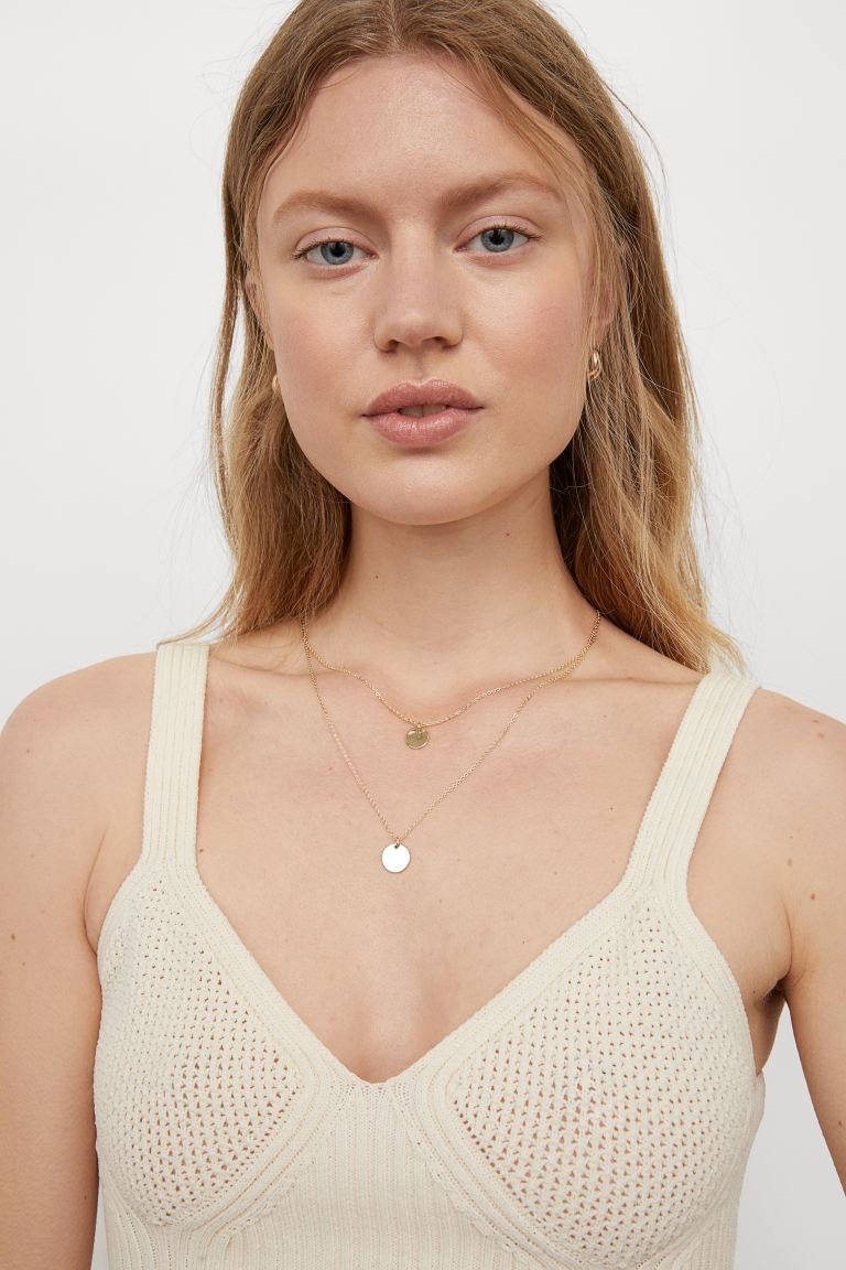 Double-strand necklace in metal chains, each with a round pendant. Adjustable length with trigger... | H&M (US + CA)