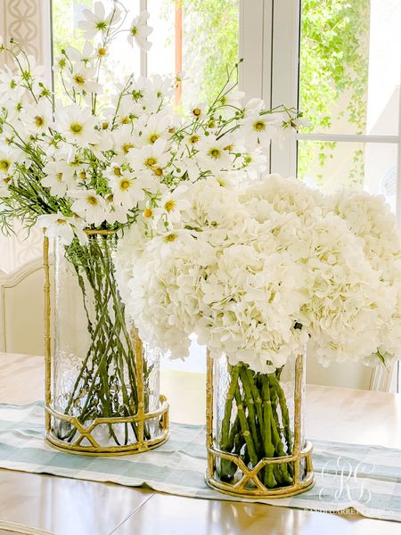 These are my favorite faux white hydrangeas! They look and feel so realistic! I love using hurricanes as vases. These cosmos are stunning and the perfect spring / summer decor. I have 4 sets of hydrangeas and 12 cosmos in my vases

#LTKFindsUnder100 #LTKHome #LTKStyleTip