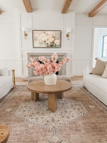 Spring living room views from last year! These pink faux cherry blossoms are so stunning and were a huge hit - sharing similar ones in a light pink color and an identical version in the color white. The quality is unmatched!

Spring living room, light and bright, living room refresh, faux florals, spring refresh, furniture faves, round coffee table, tv frame art, bright and airy, vintage style area rug, pops of pink, neutral wood tone, warm whites, wall sconce, neutral aesthetic, neutral home, spring style inspo, my home decor, Afloral, Becki Owens Rug, 

#LTKstyletip #LTKSeasonal #LTKhome