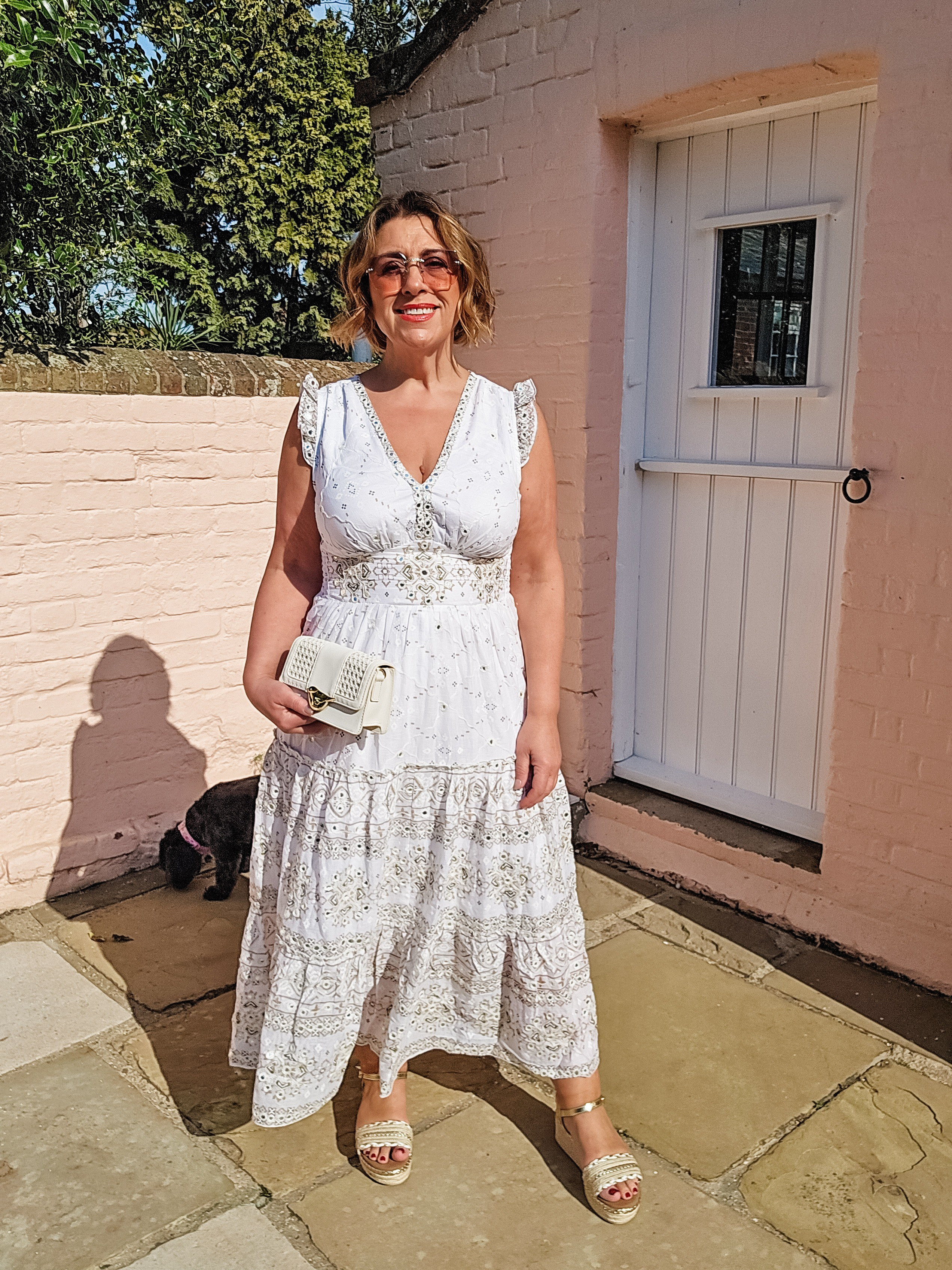 The perfect white cotton embellished beach to bar dress, giving all the Ibiza vibes. Lightweight,  ideal for packing. The perfect midi length for petite 

#LTKsummer #LTKover50style #LTKpetite