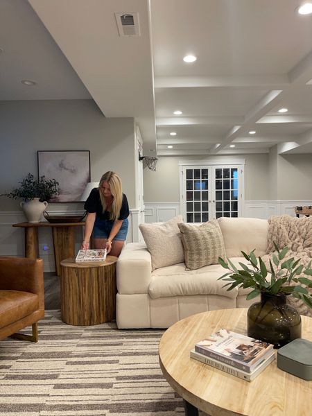 Basement styling inspo! Our basement is filled with warm brown tones and neutrals to contrast the dark cabinets and floors. #basement 

#LTKsalealert #LTKFind #LTKhome